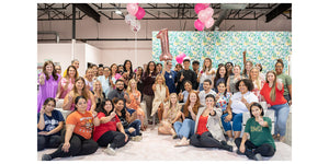 large group photo with balloons in background