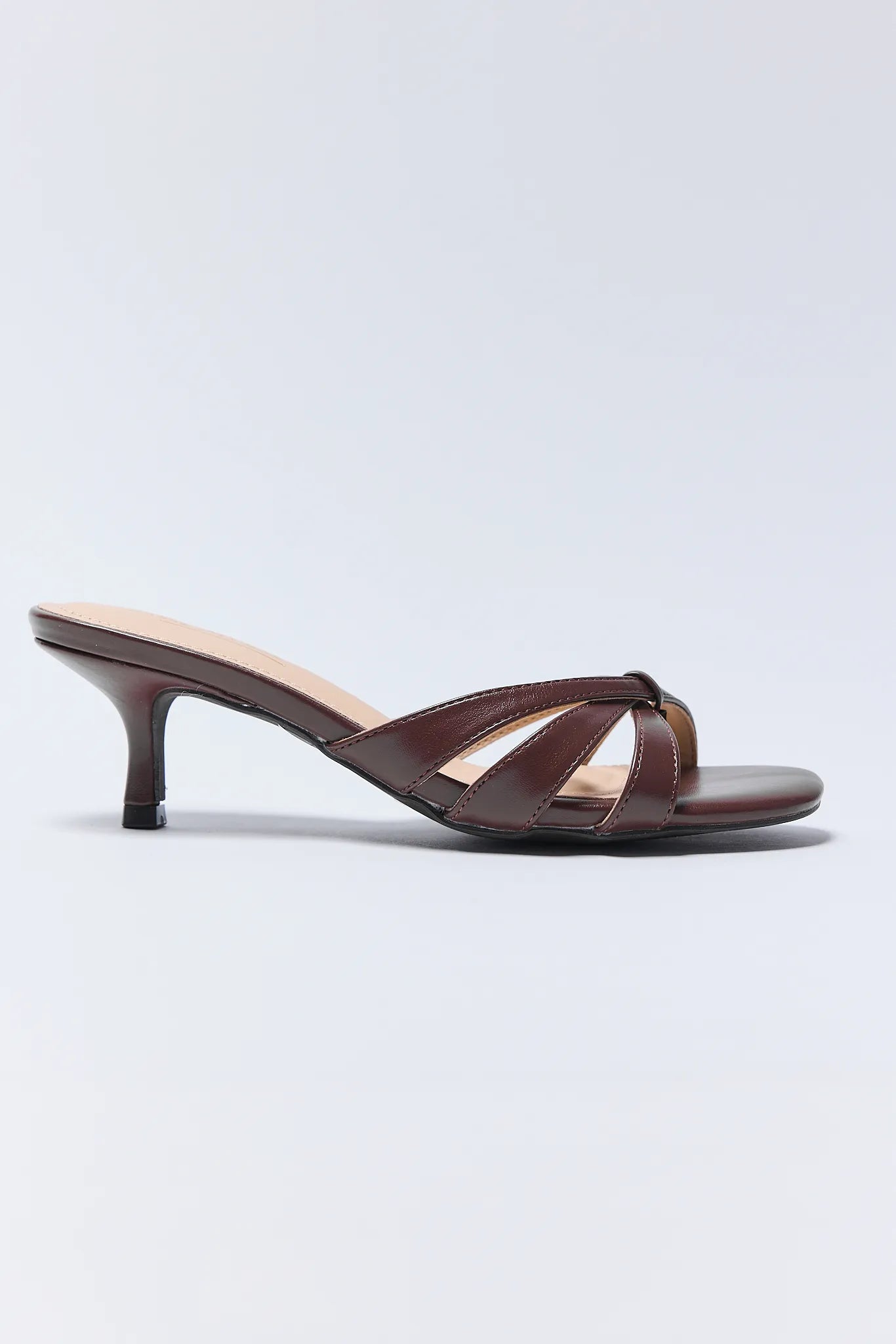 Brown Addison Heels with a thin strap on a light gray background