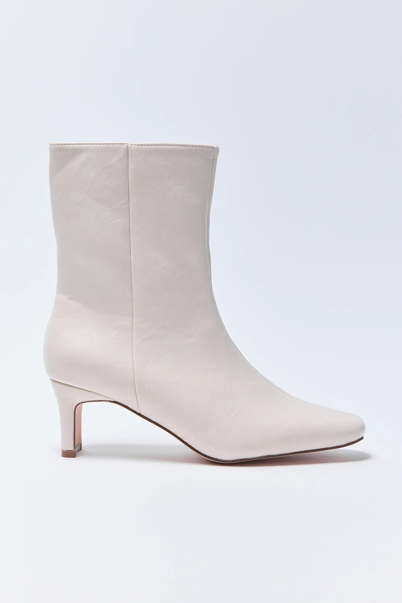 Beige ankle Adler Boots on a white background
