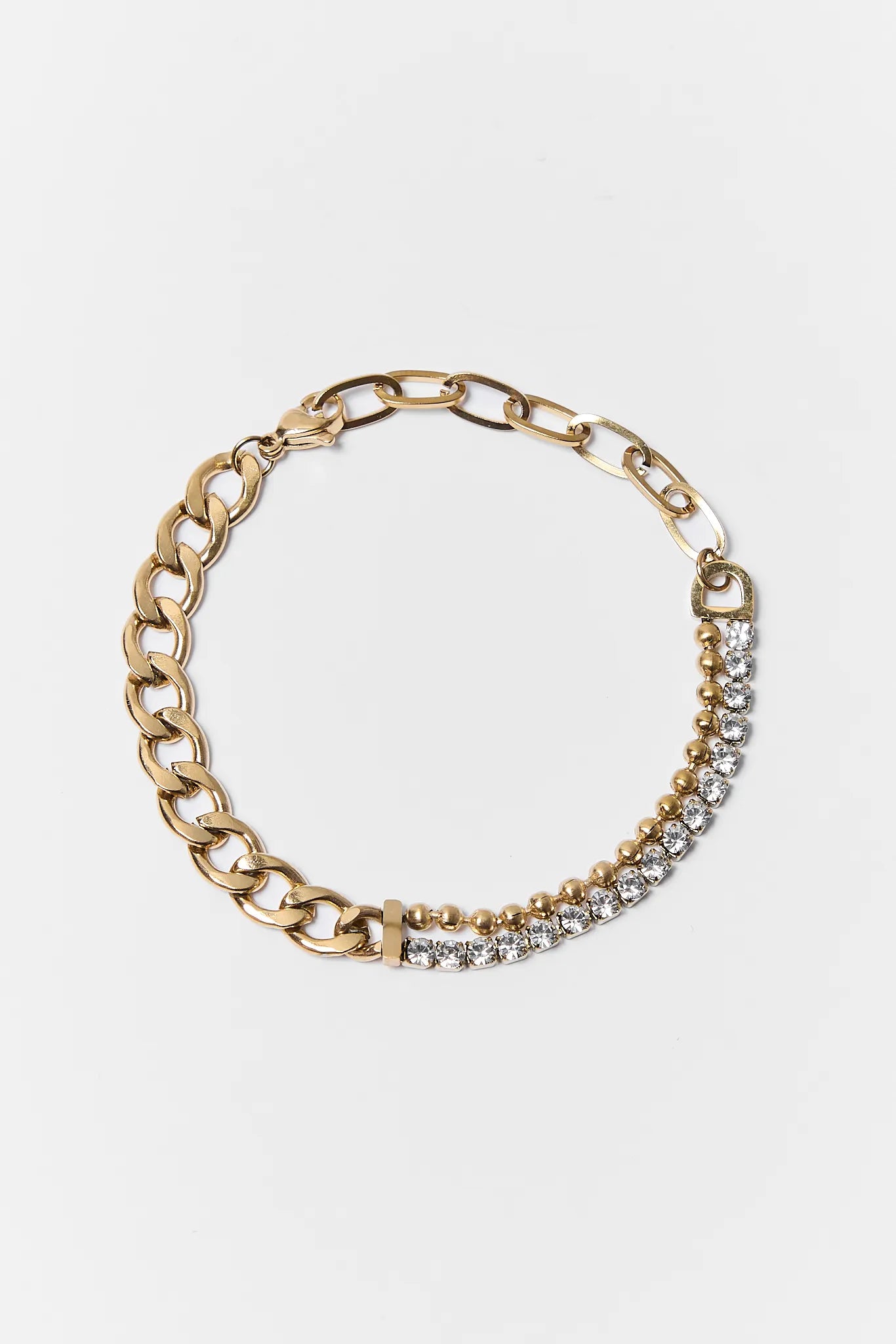 Gold chain bracelet with embedded crystals on a white background