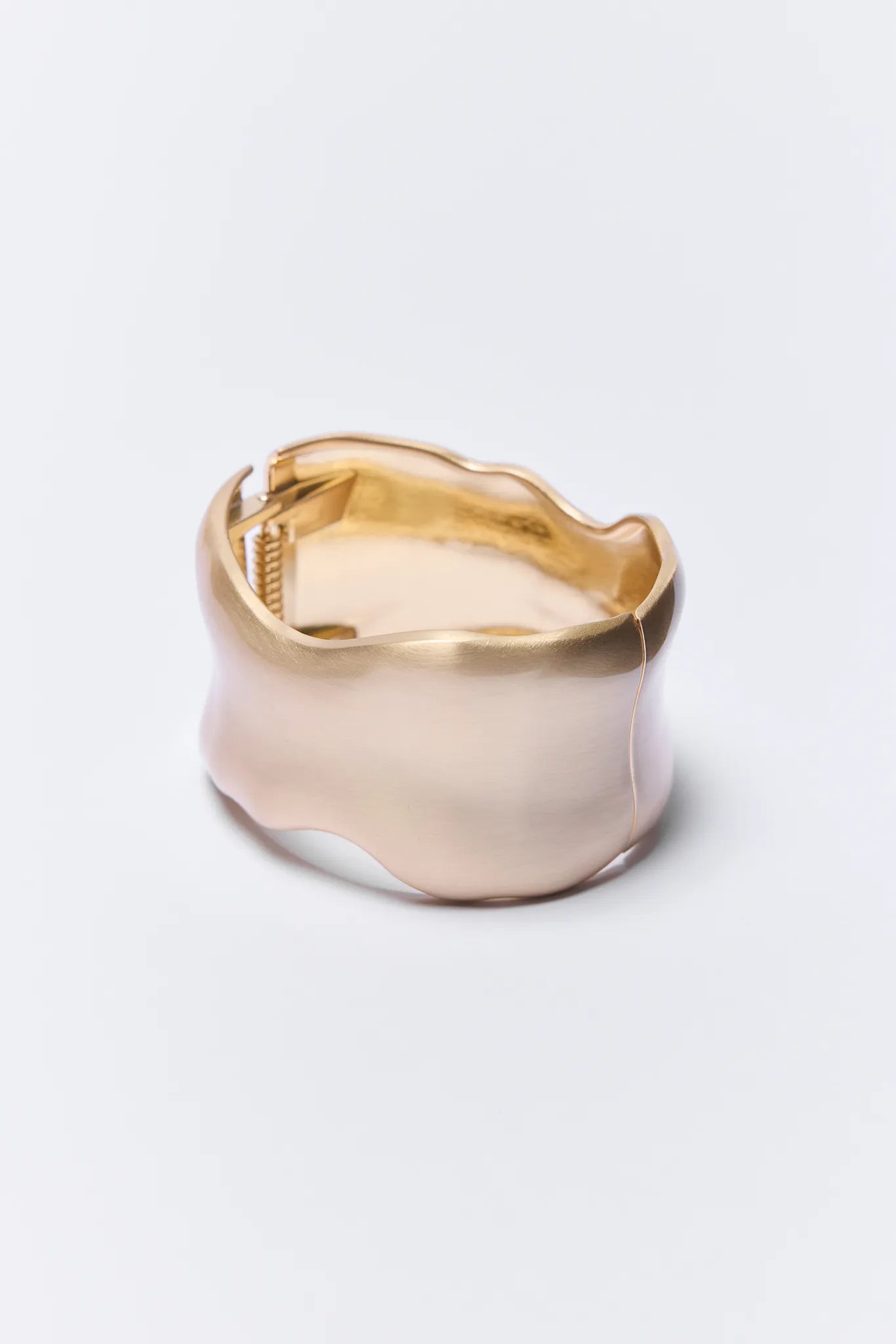 Gold and silver Arden Bracelet on a white background