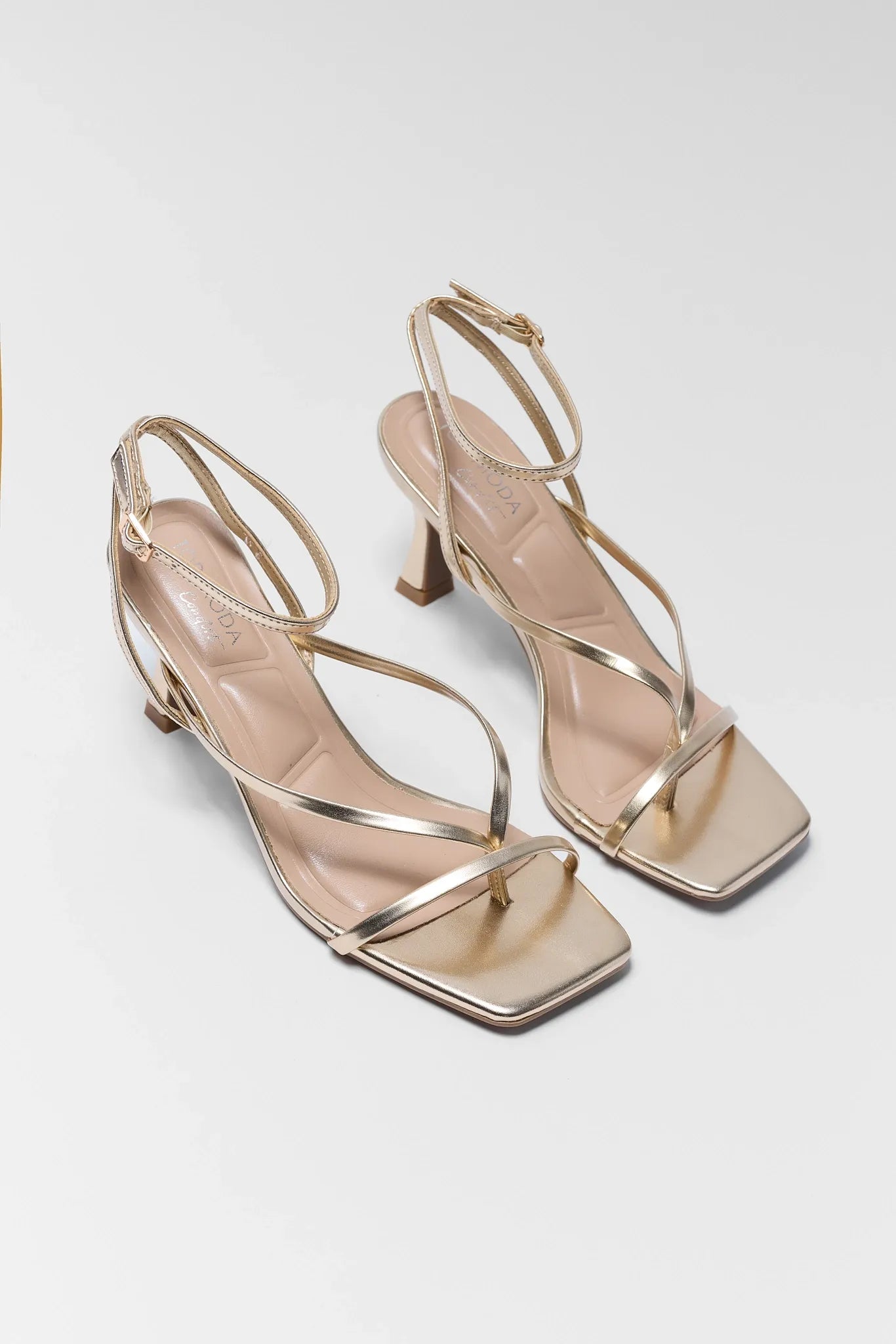 two Ashton Gold Strappy Square Toe Heels on white background