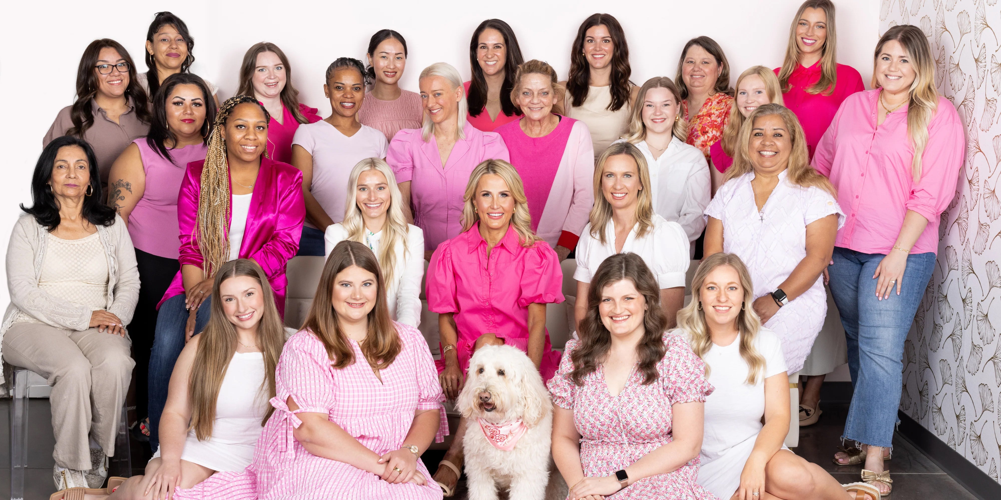 group of women wearing pink outfits