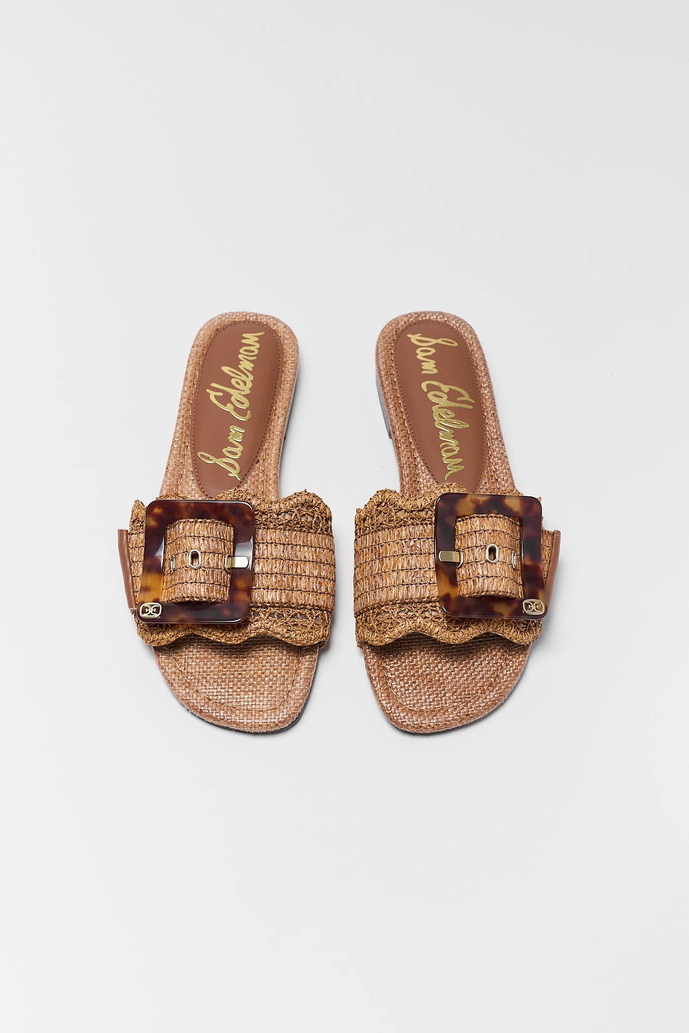Bambi Tan Woven Buckle Sandals on background