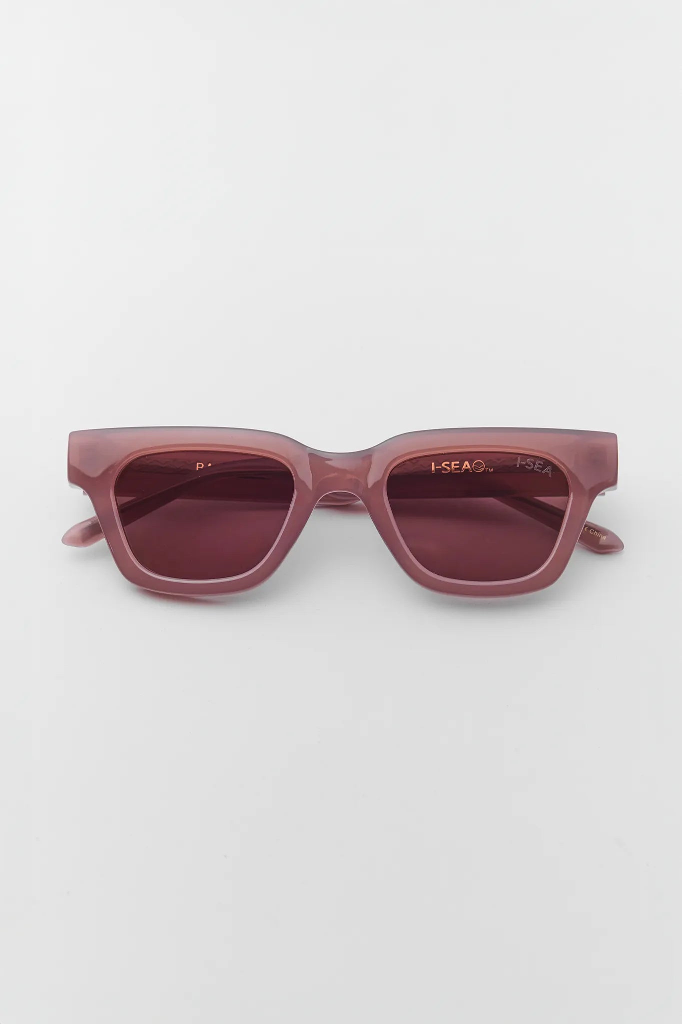 Maroon sunglasses on a white background