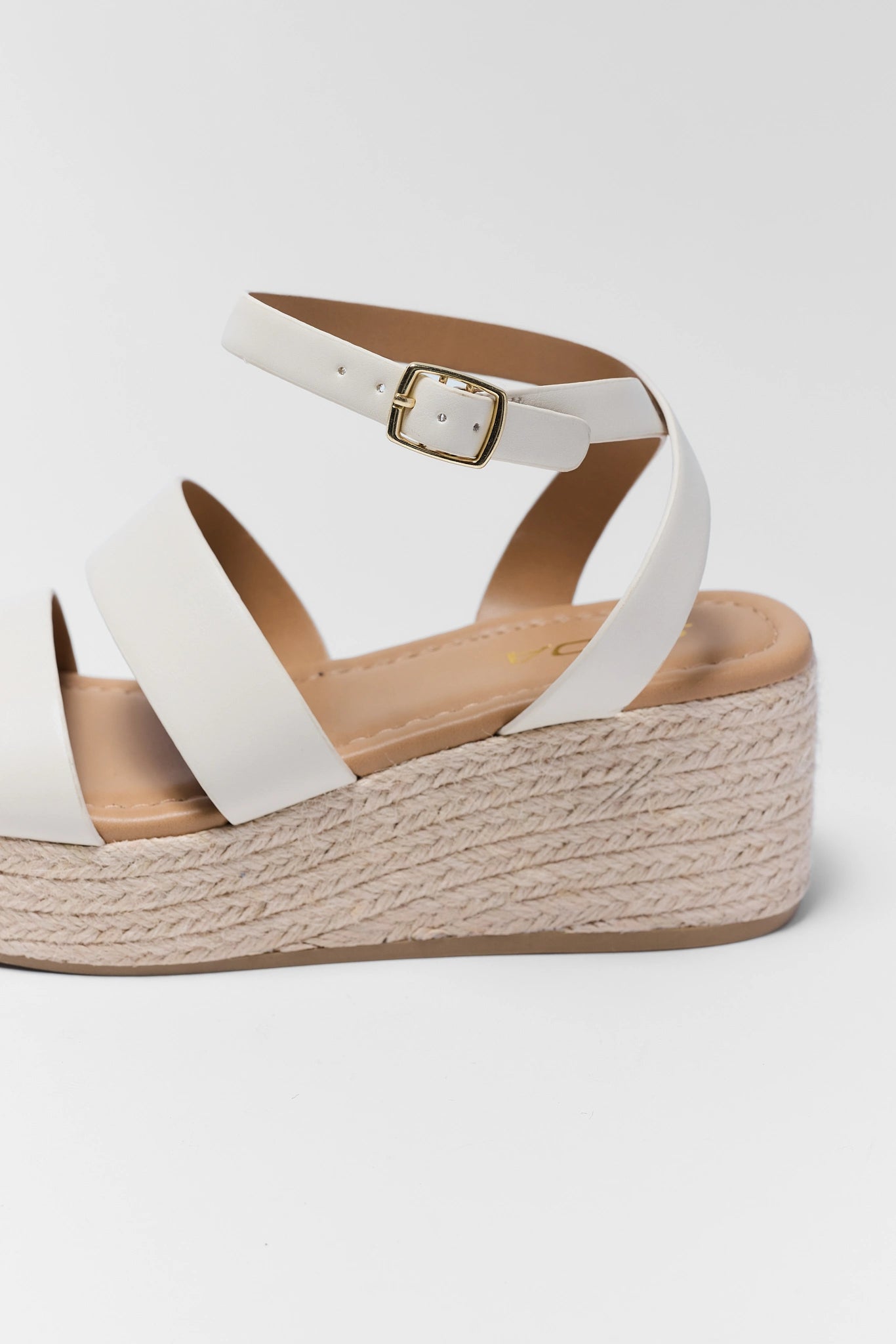 close up of Bella White Braided Wedges on white background