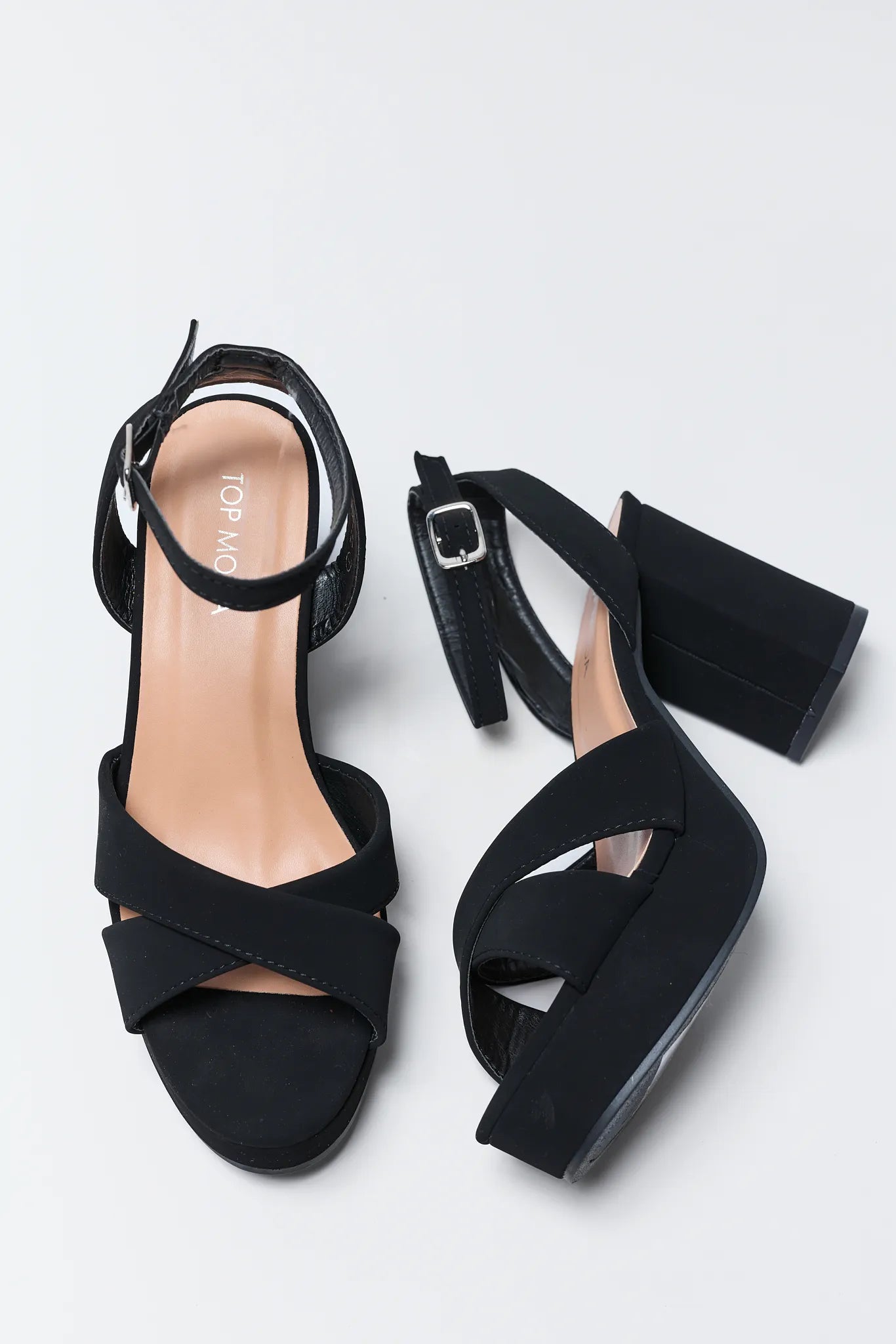 Beverly Black Platform Heels on a light gray background