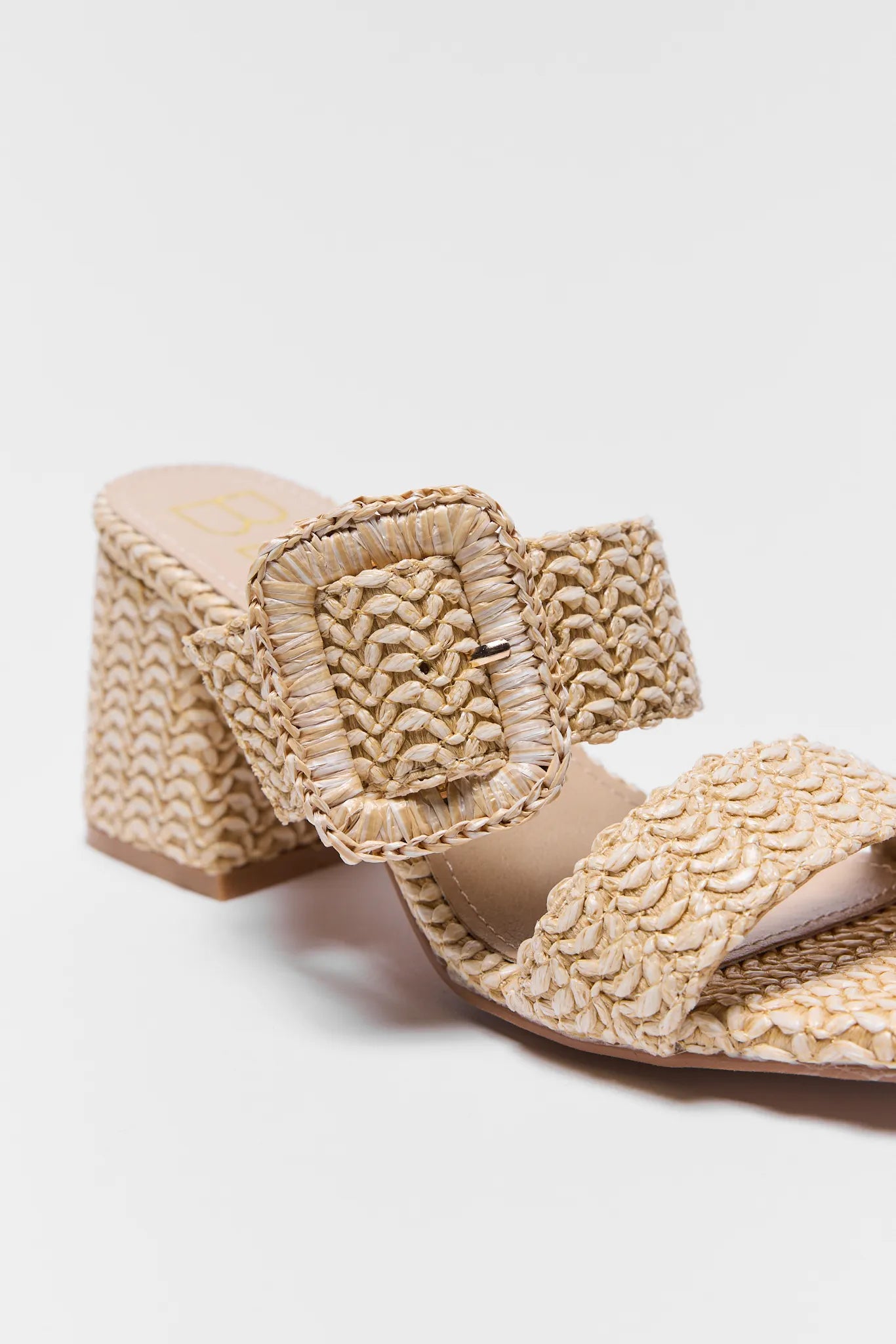 Detailed photo of Beige woven sandal with a buckle on a light gray background