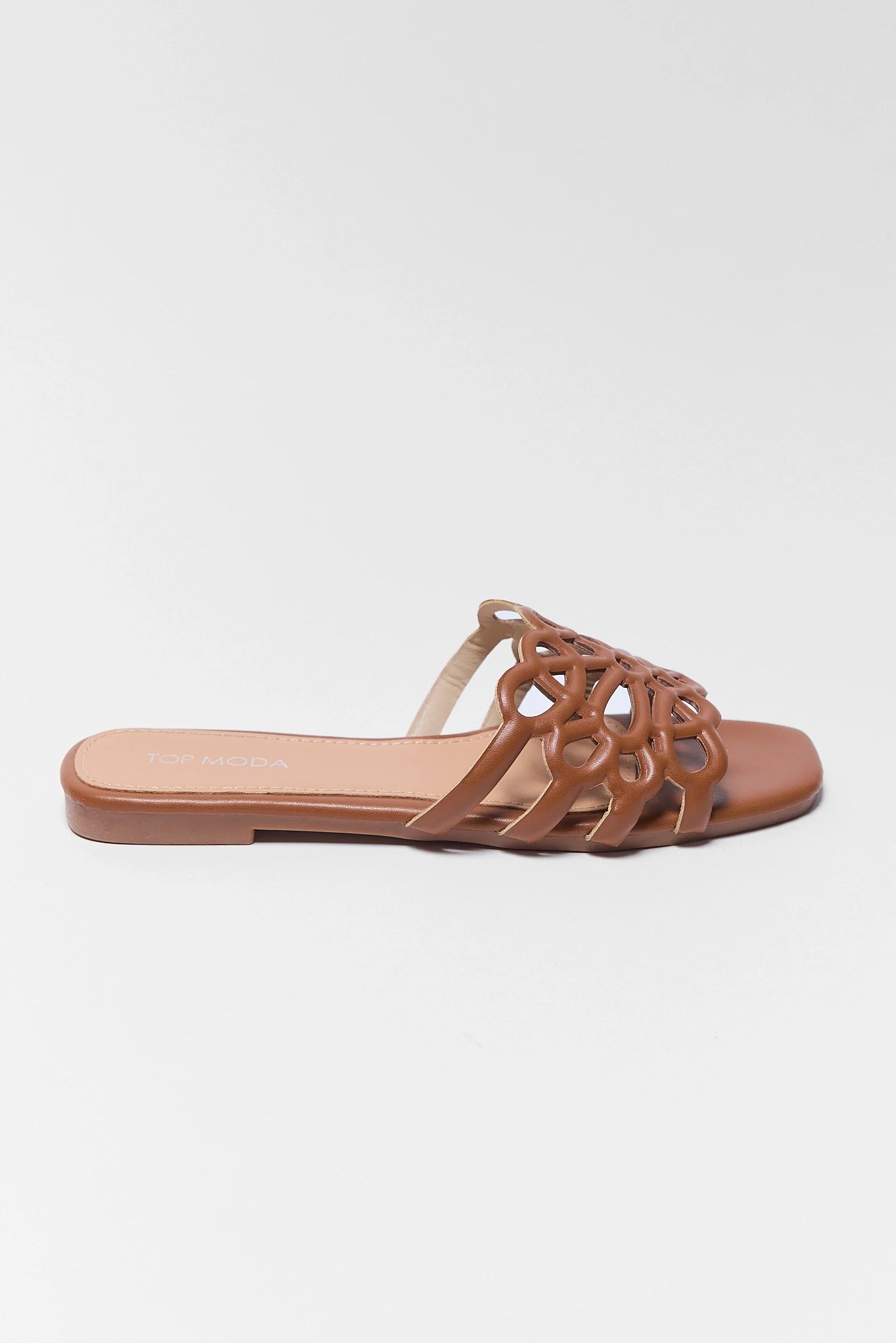 one Brown sandal with open-toe design on a white background