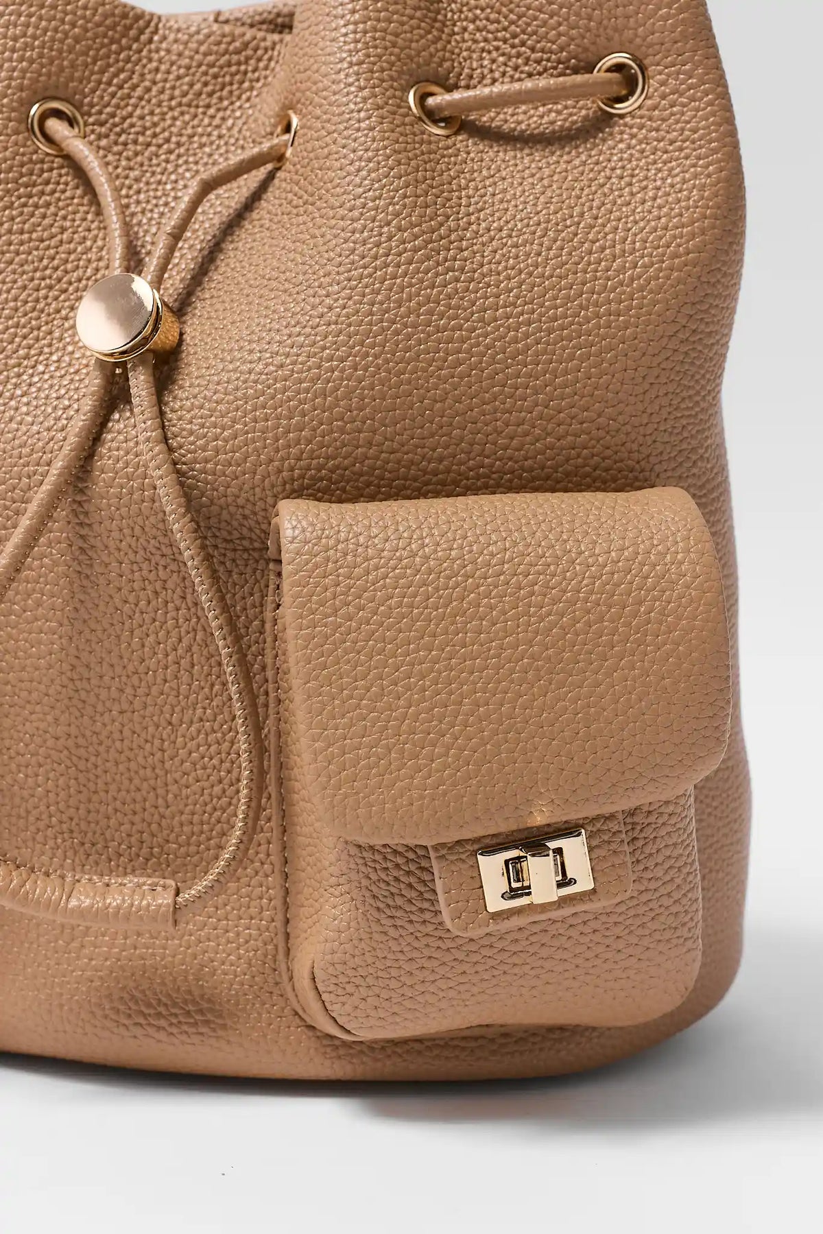 Tan Faux Leather Drawstring Backpack - Flap Pocket & Gold Turnlock Hardware Detail | Avara