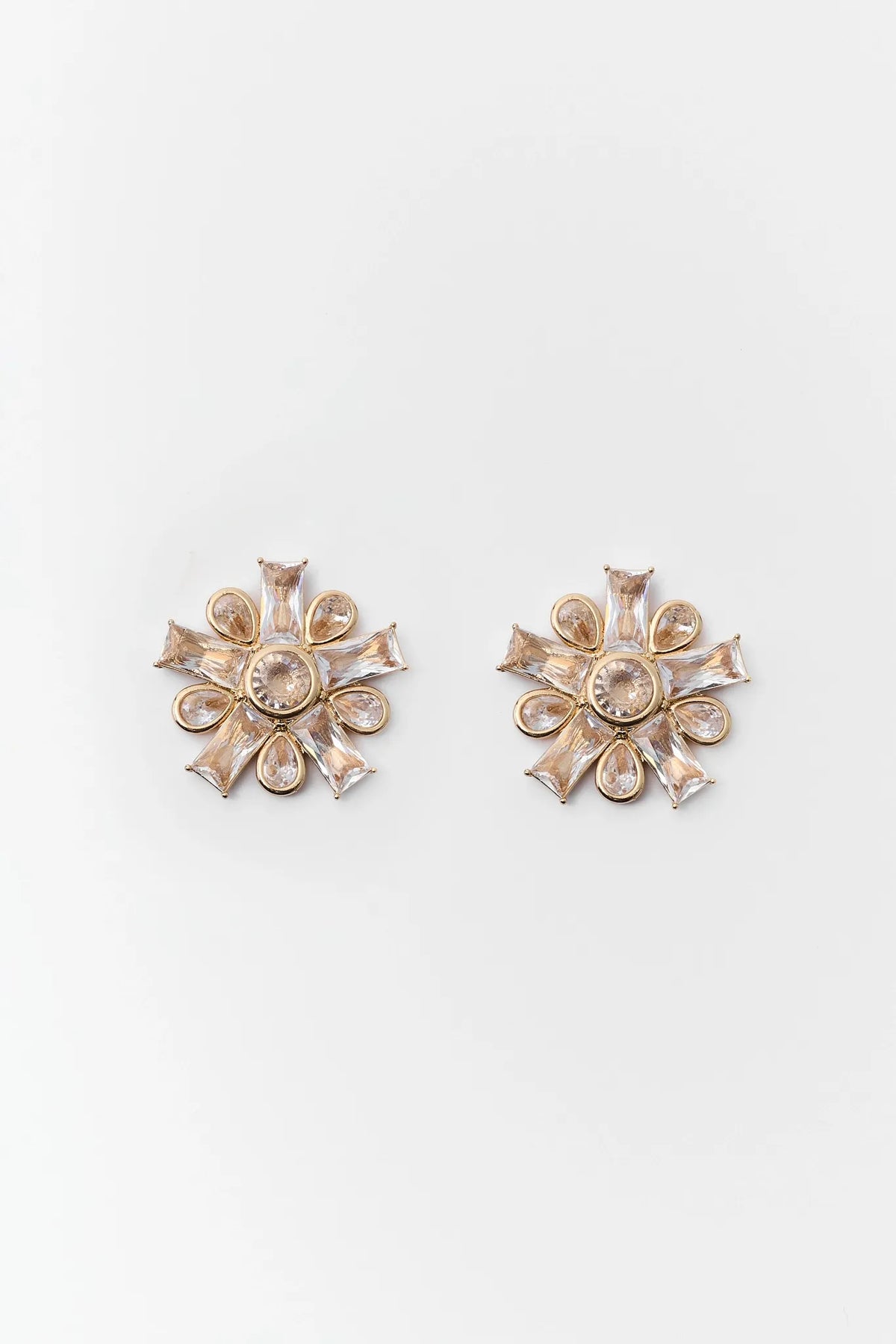 Clear Crystal Gold-Tone Starburst Stud Earrings - Flat Lay Product View | Avara