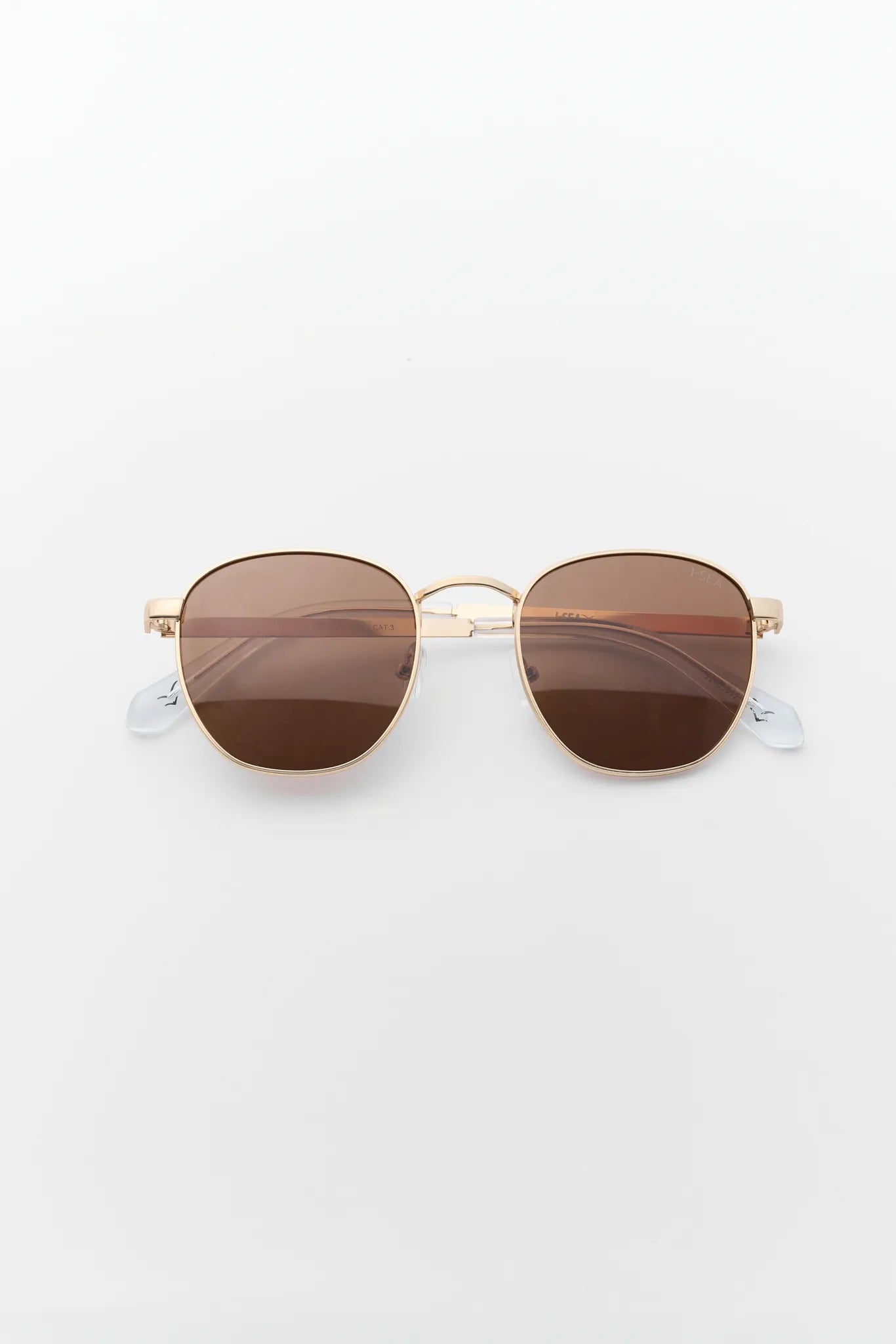 Gold-framed sunglasses with brown lenses on a white background