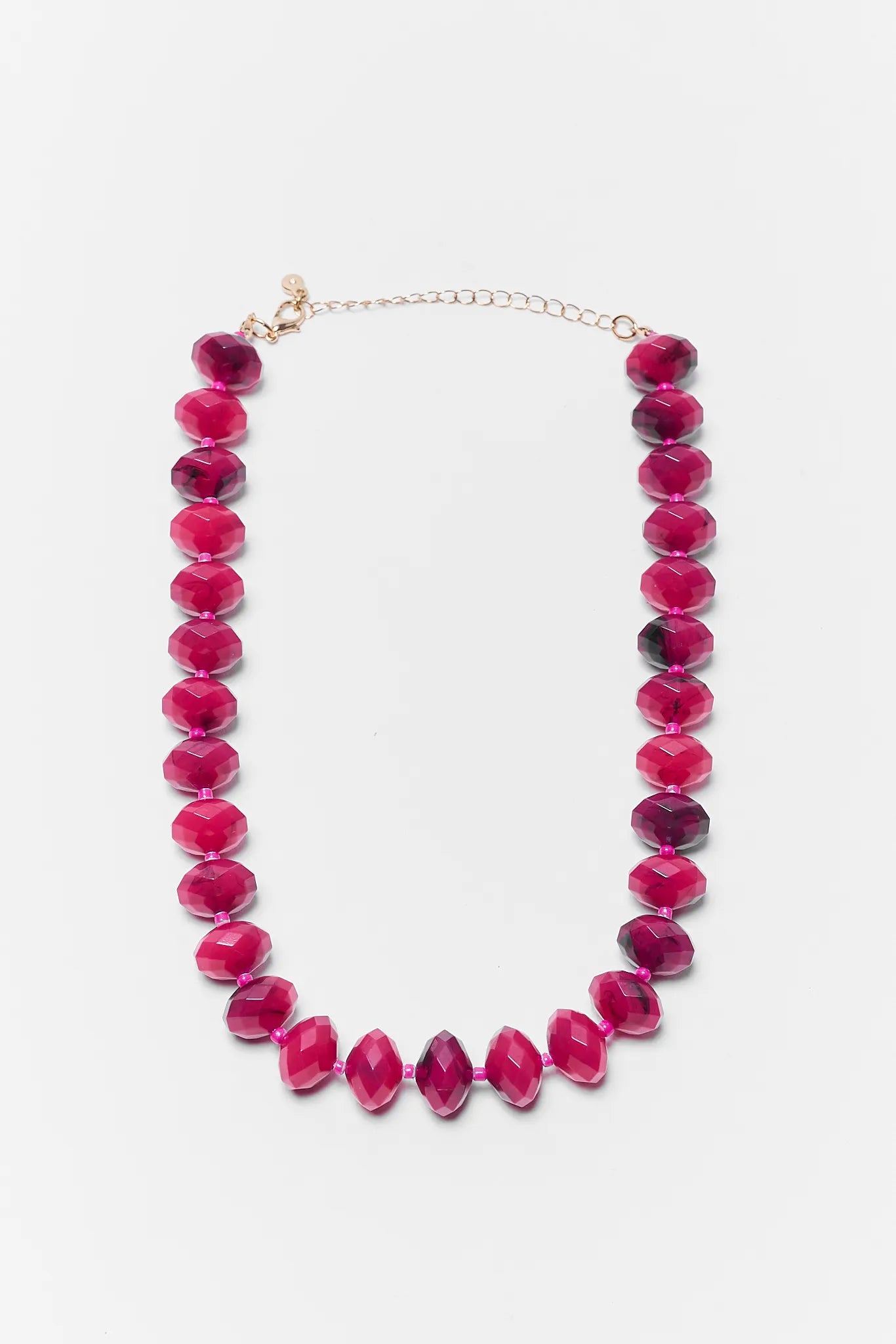 Necklace with pink beads on a white background