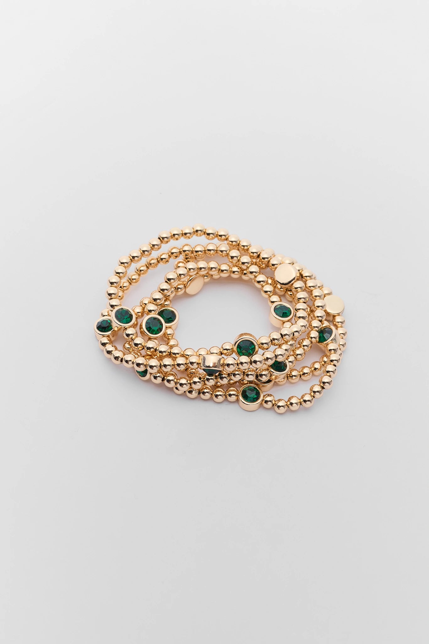Gold Beaded green Rhinestone Bracelet on a white background