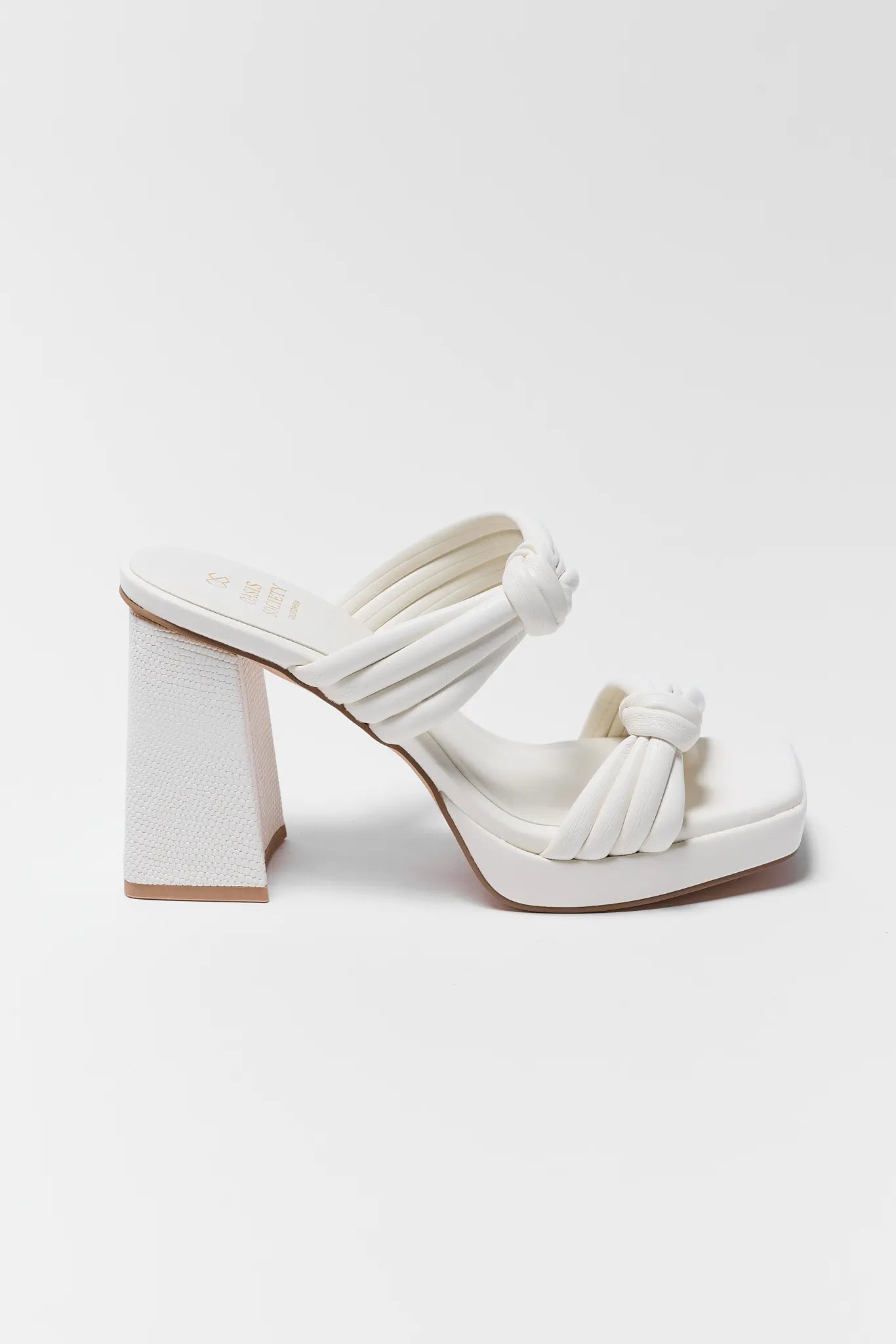 White sandal with block heel on a white background