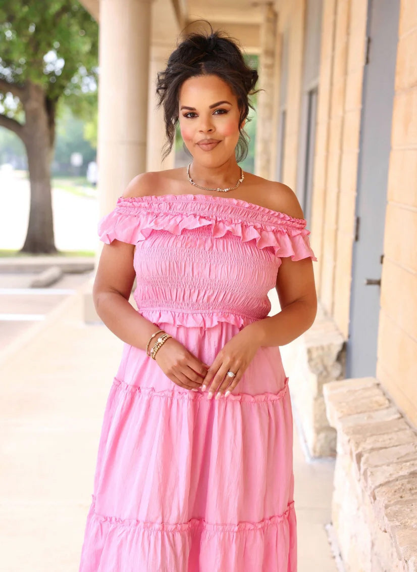 women wearing pink dress with blurred background