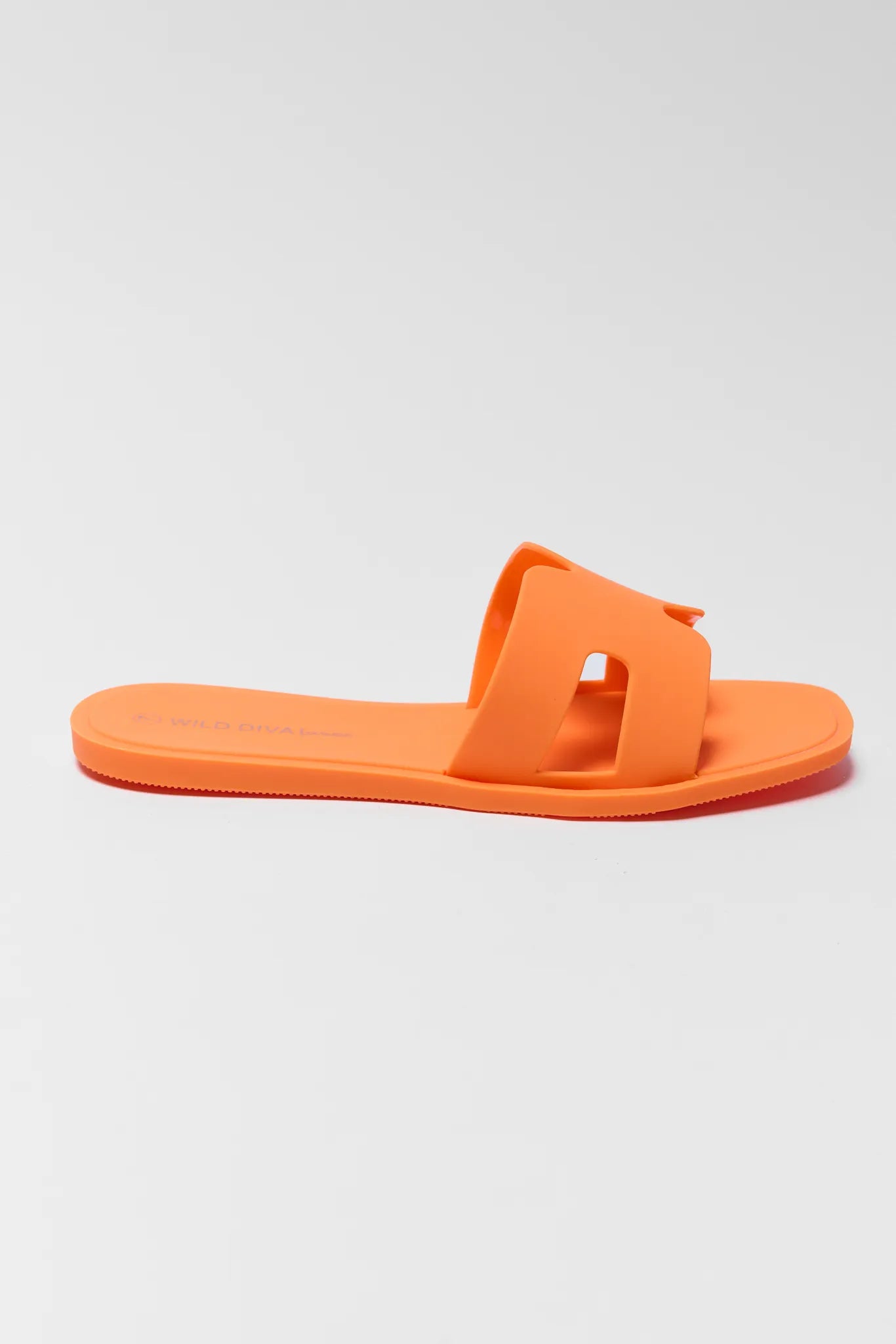 Orange jelly sandal on a light gray background