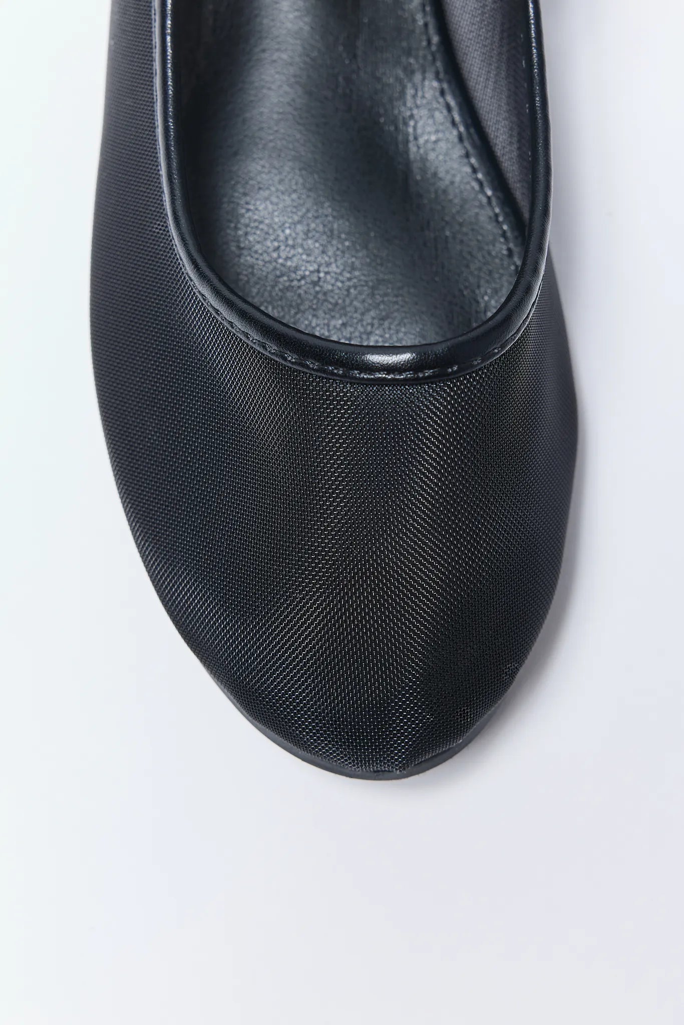 Black Jane Flats on a white background