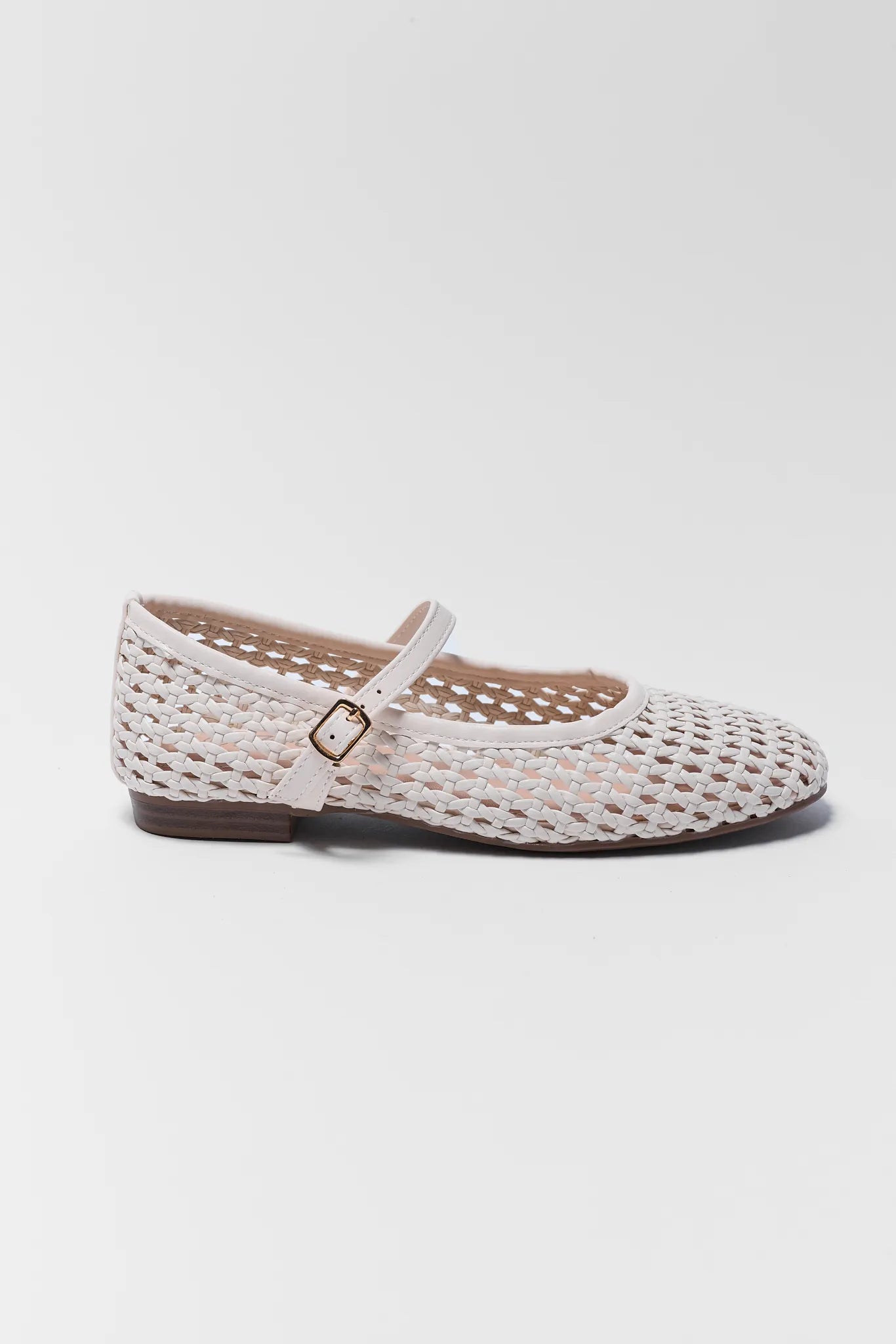 Woven shoe with a strap on a white background