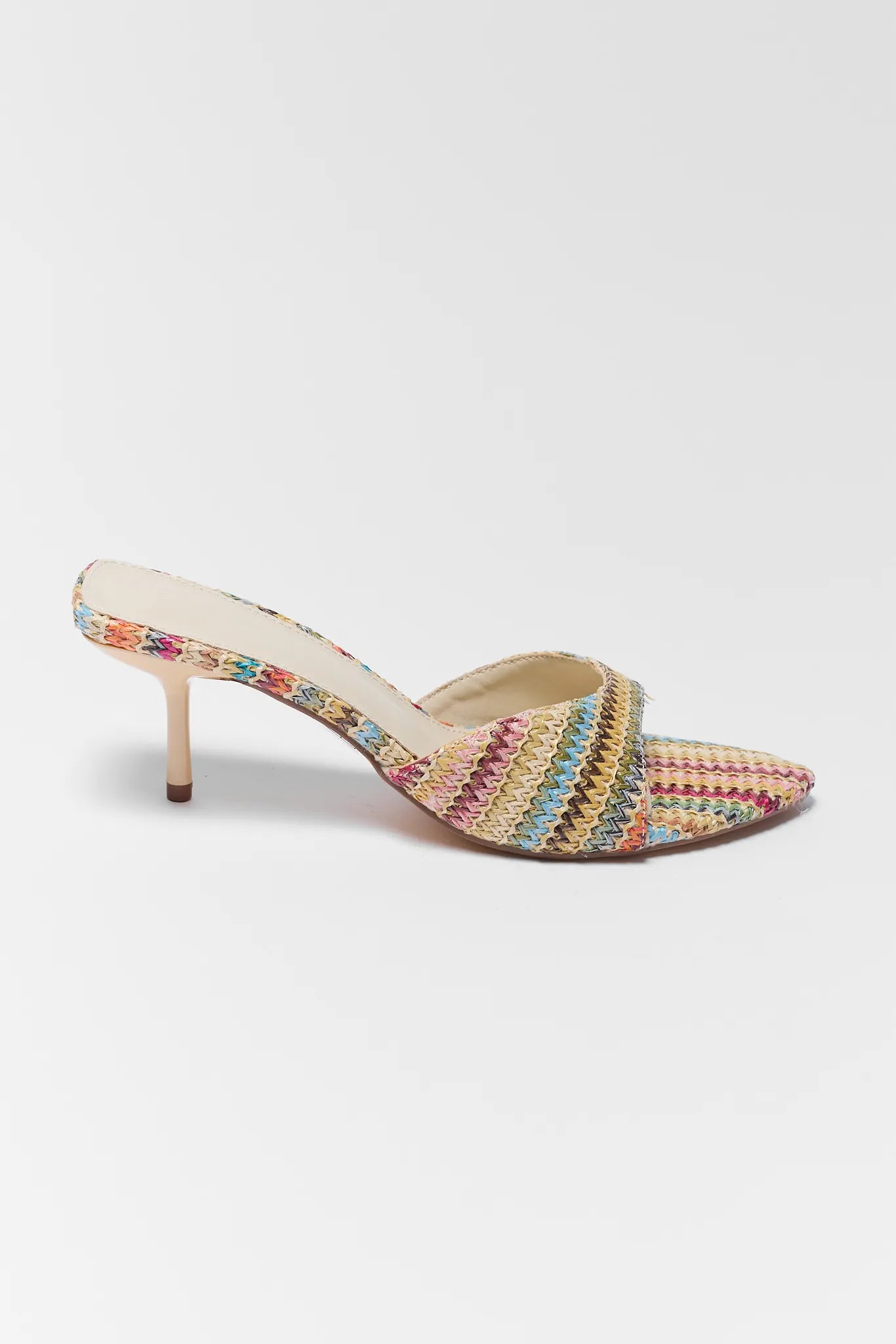 Multicolored woven sandal with a high heel on a white background