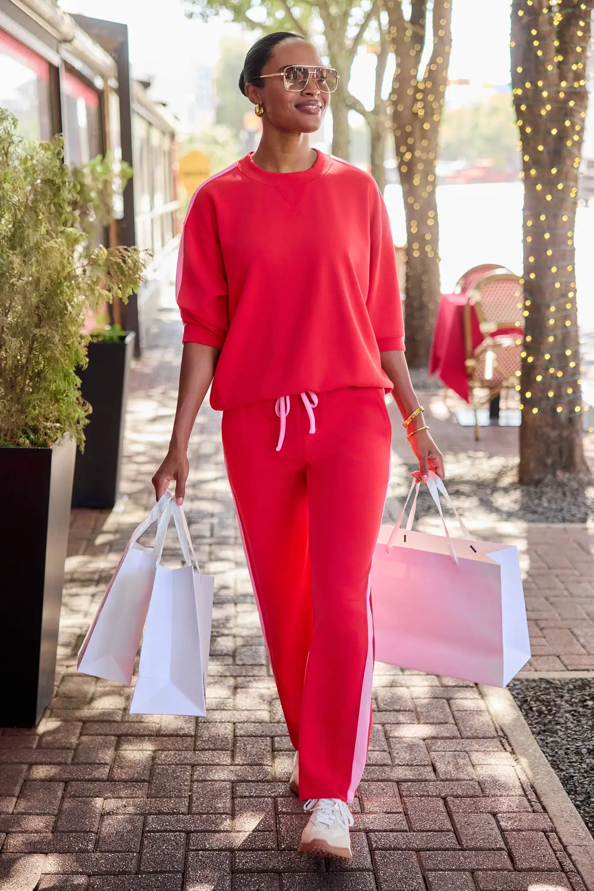 Red Wide-Leg Lounge Pants with Pink Side Stripe - Lifestyle Styled Look | Avara