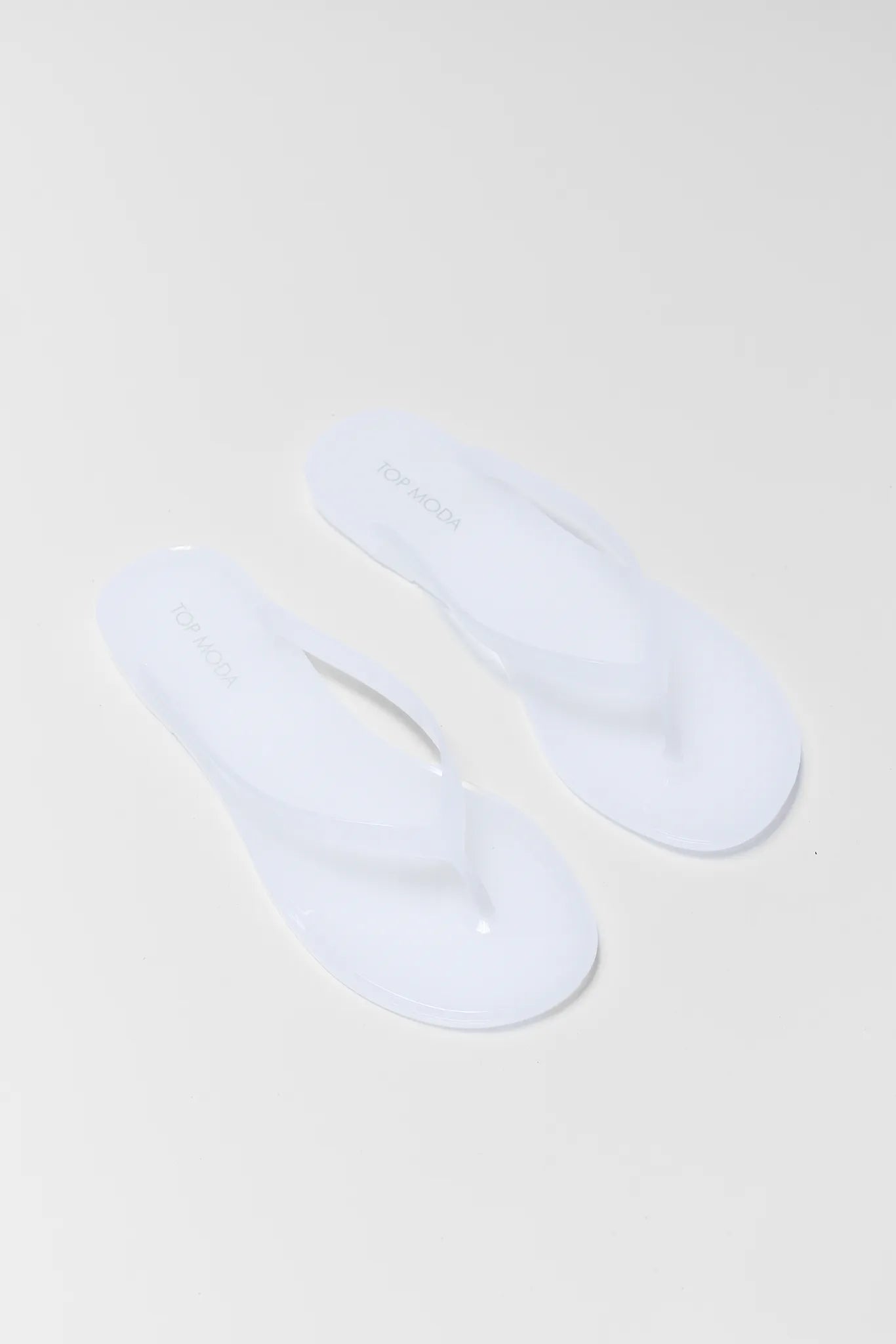 Two white socks on a beige background