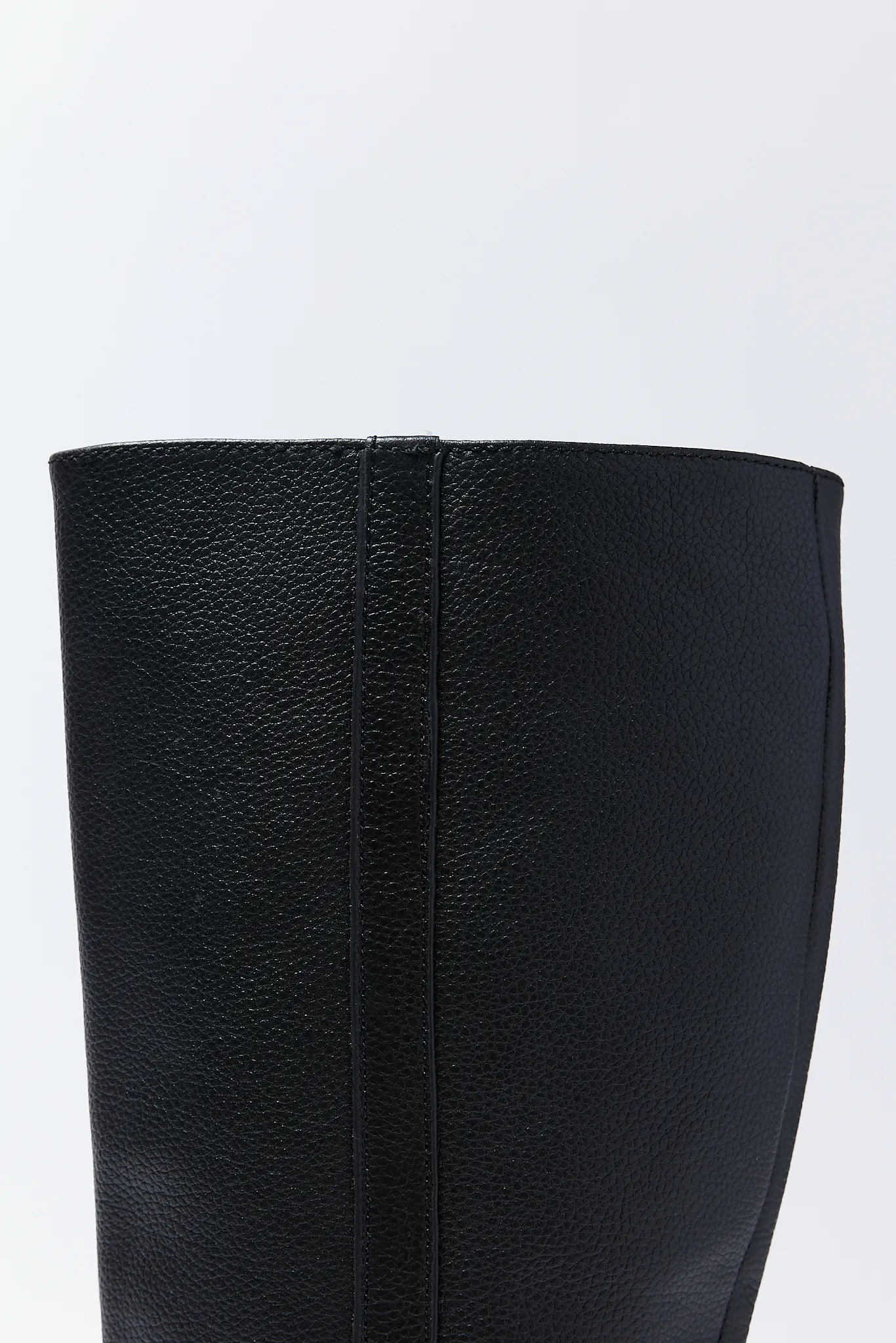 Close-up of a black leather Kilian Boots on a white background