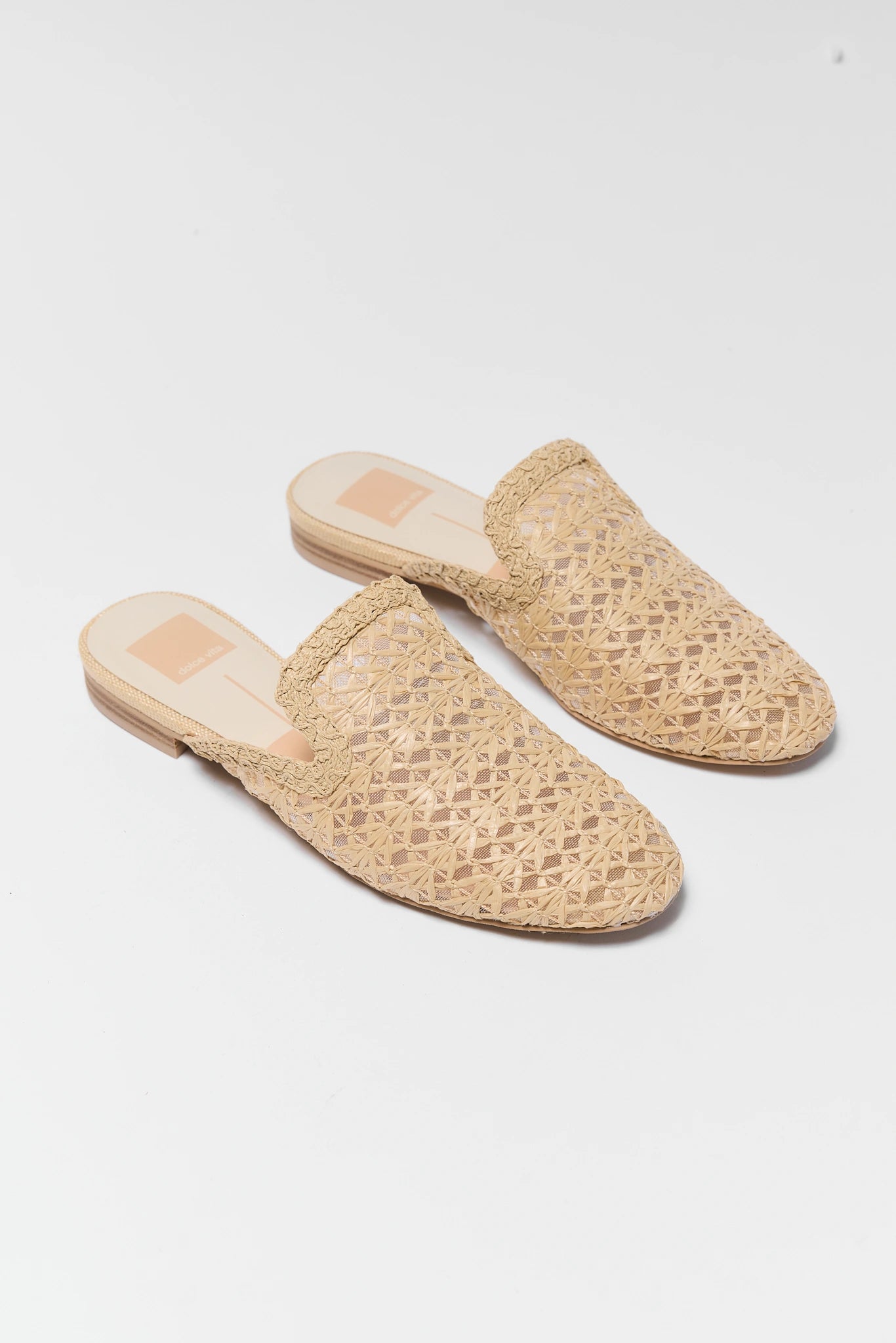 Pair of woven sandals on a white background