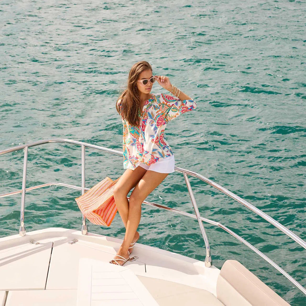 Woman on a yacht deck with ocean view