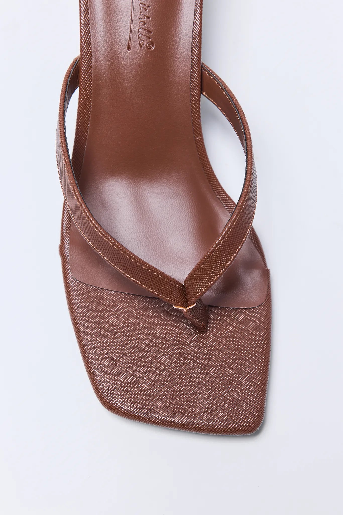 Brown Lindy Heels with mesh sole on a white background