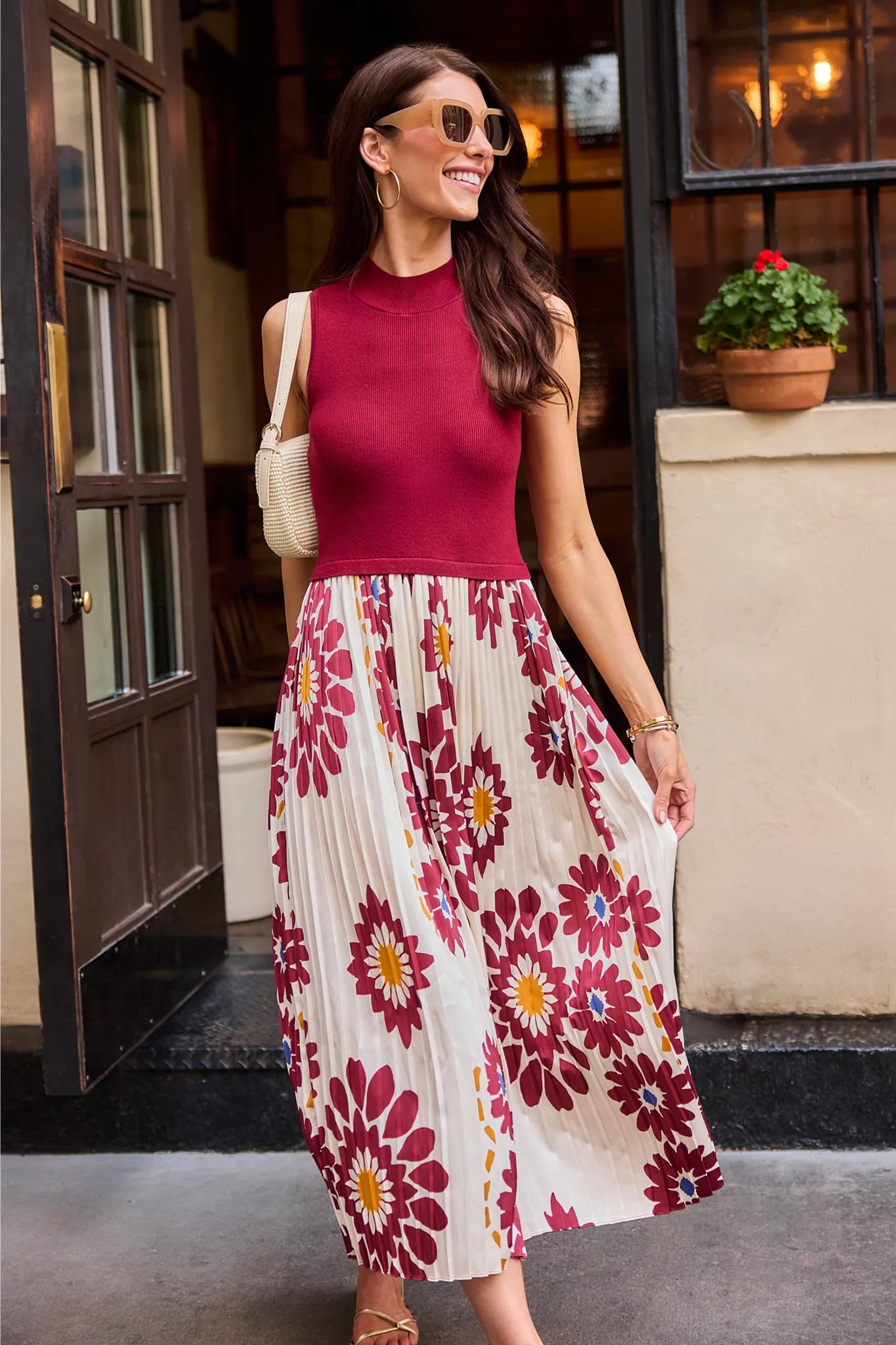 woman wearing marcia burgundy dress outdoors in city