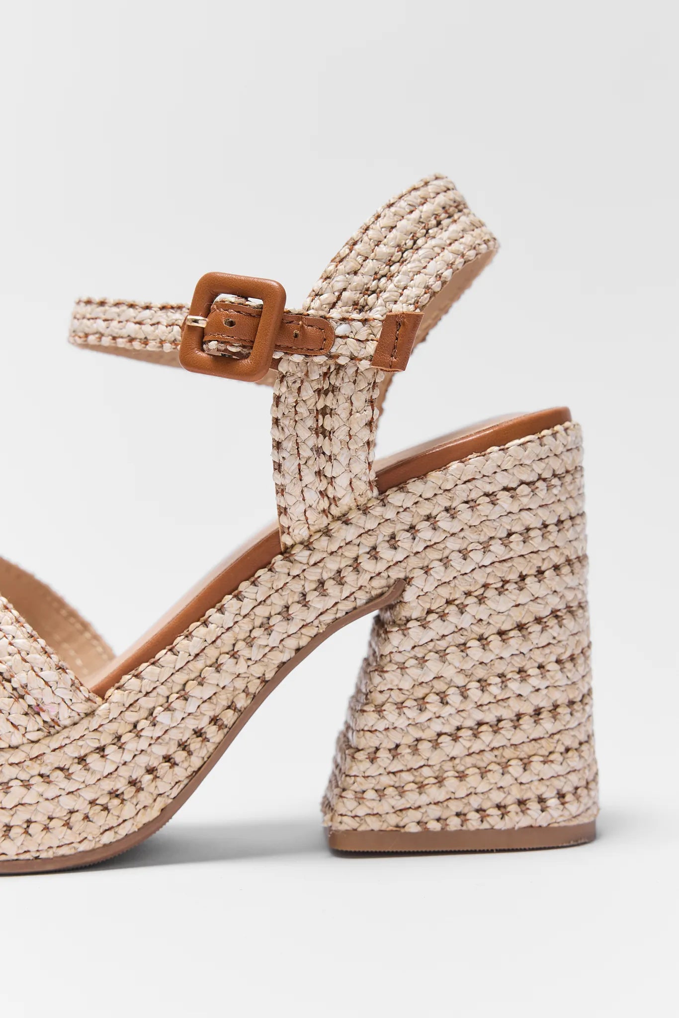 Close up of Millie Raffia Platform Heel on a light gray background