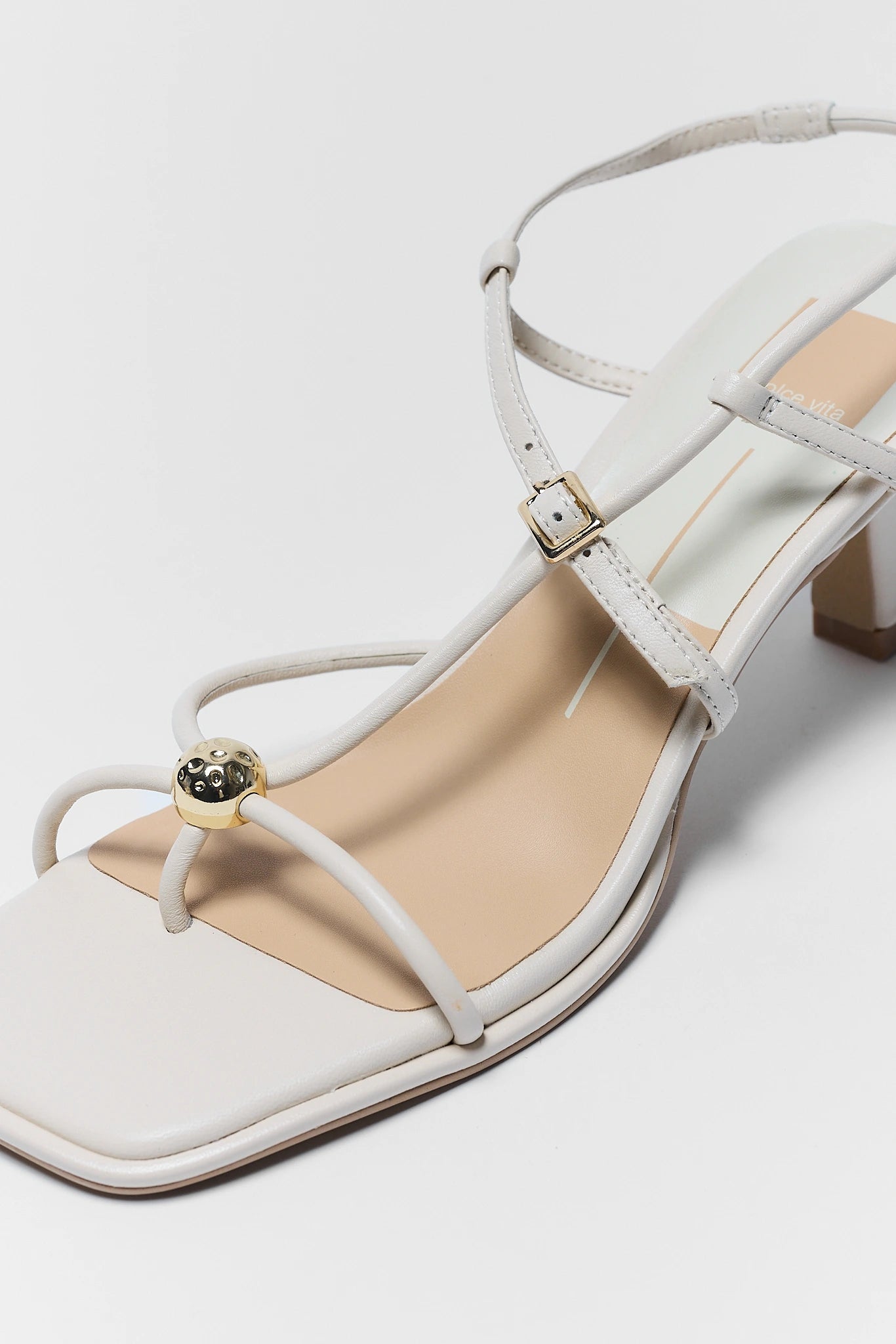 close up of Mylee Cream Strappy Kitten Heels on white background