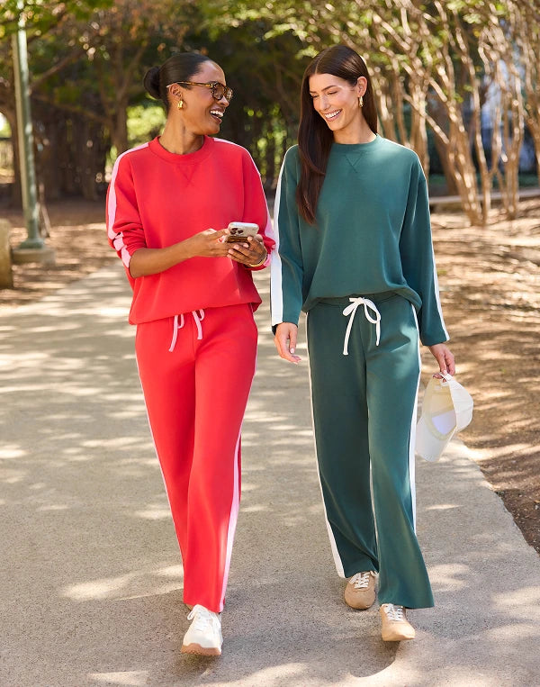 two women walking wearing sweat sets