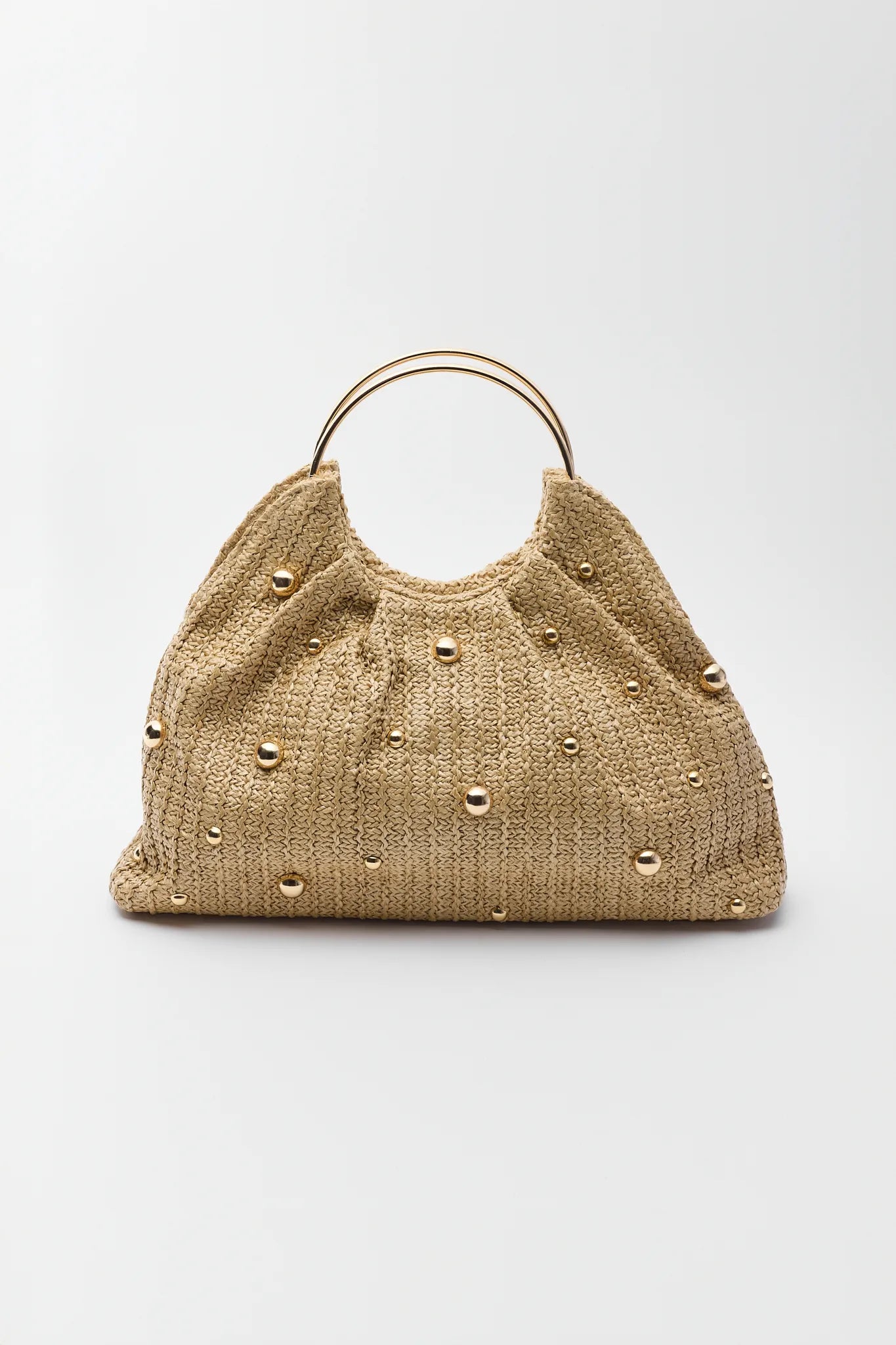 Beige woven handbag with gold studs on a light gray background