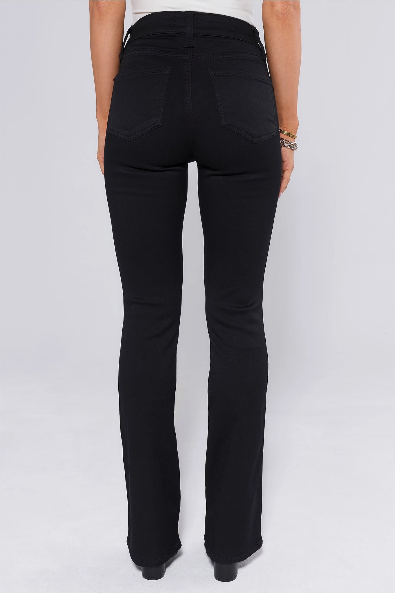 Black Natalie Jeans worn by a person on a white background