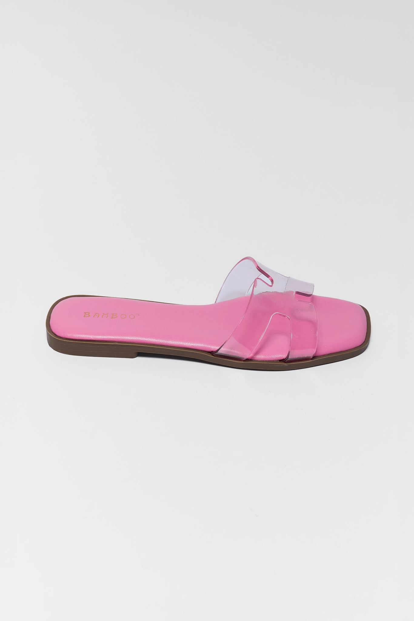 one Pink slide sandal with clear strap on a white background