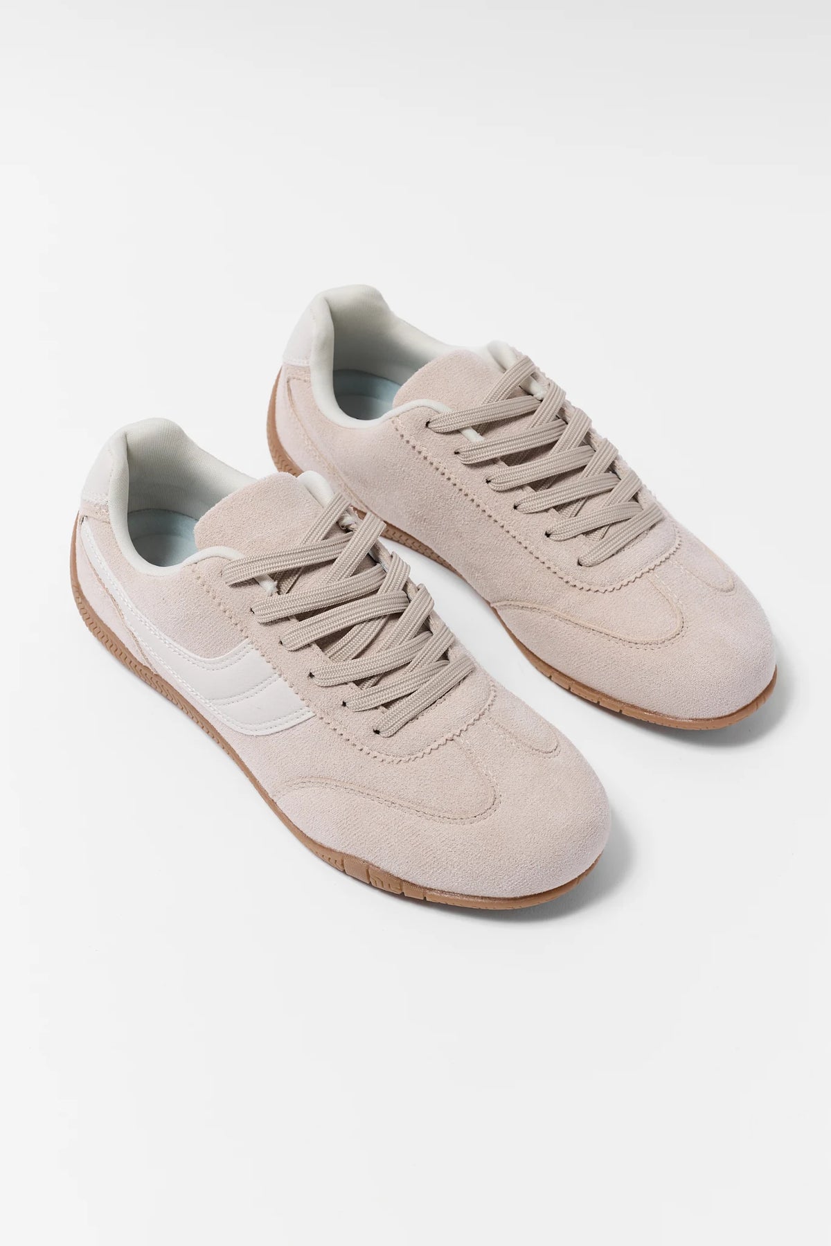 Taupe Suede Low Profile Sneakers - Angled Pair Flat Lay with White Accent | Avara