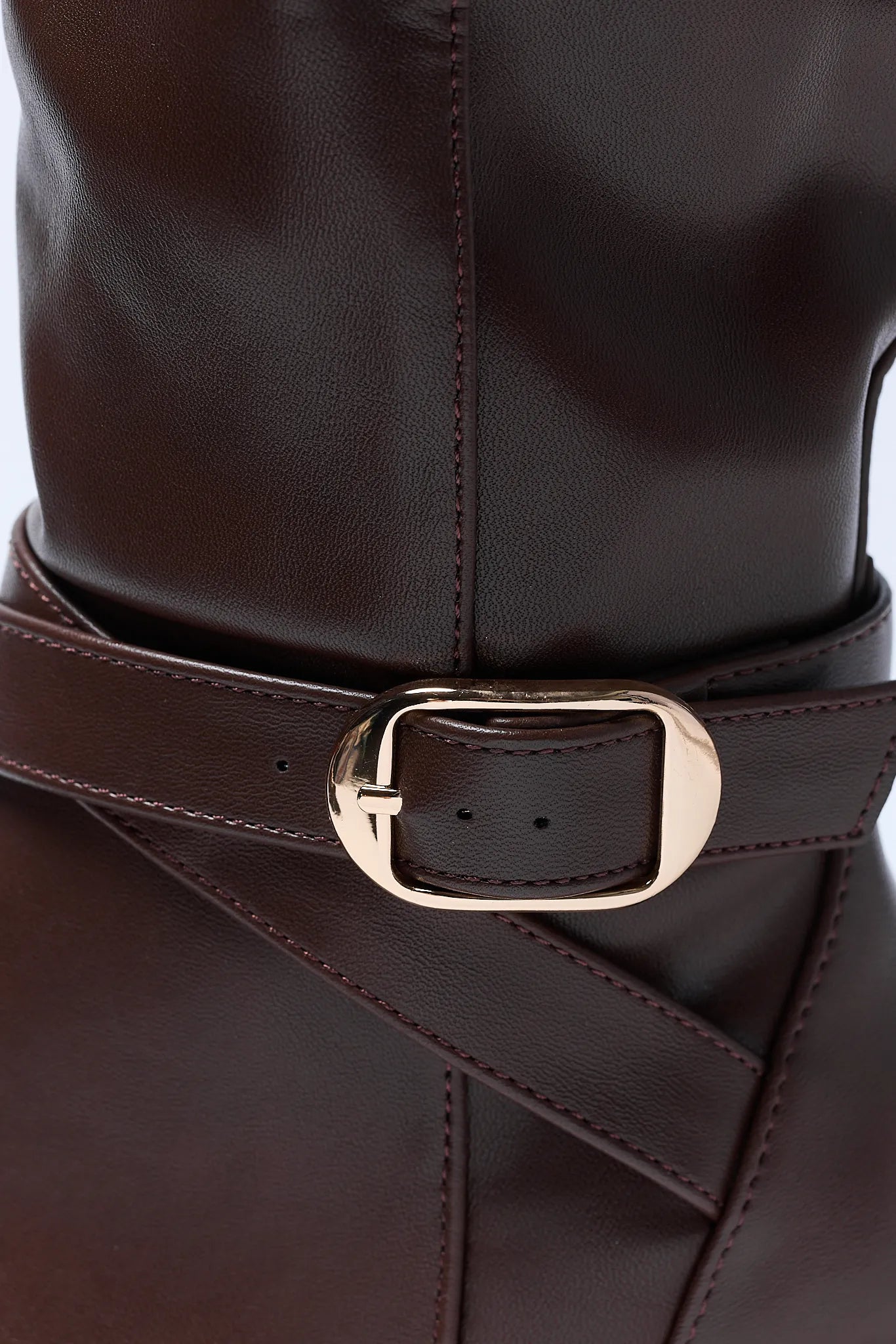 Brown leather Prudence Boot with a gold buckle on a white background