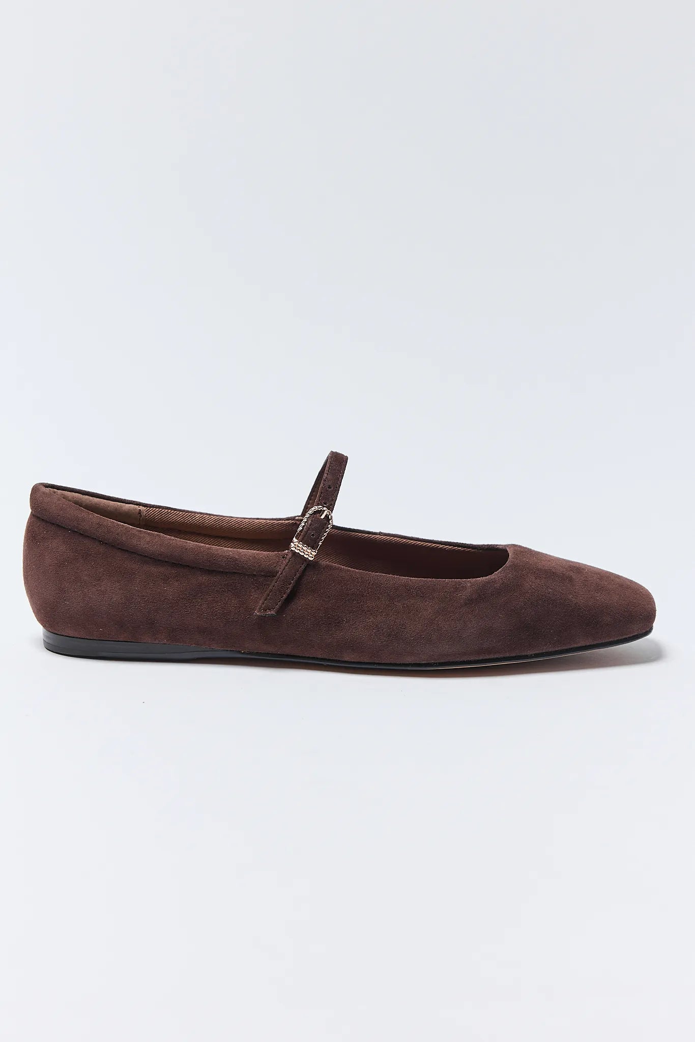 Brown suede flat Reyes Ballet Flats with a strap on a light gray background