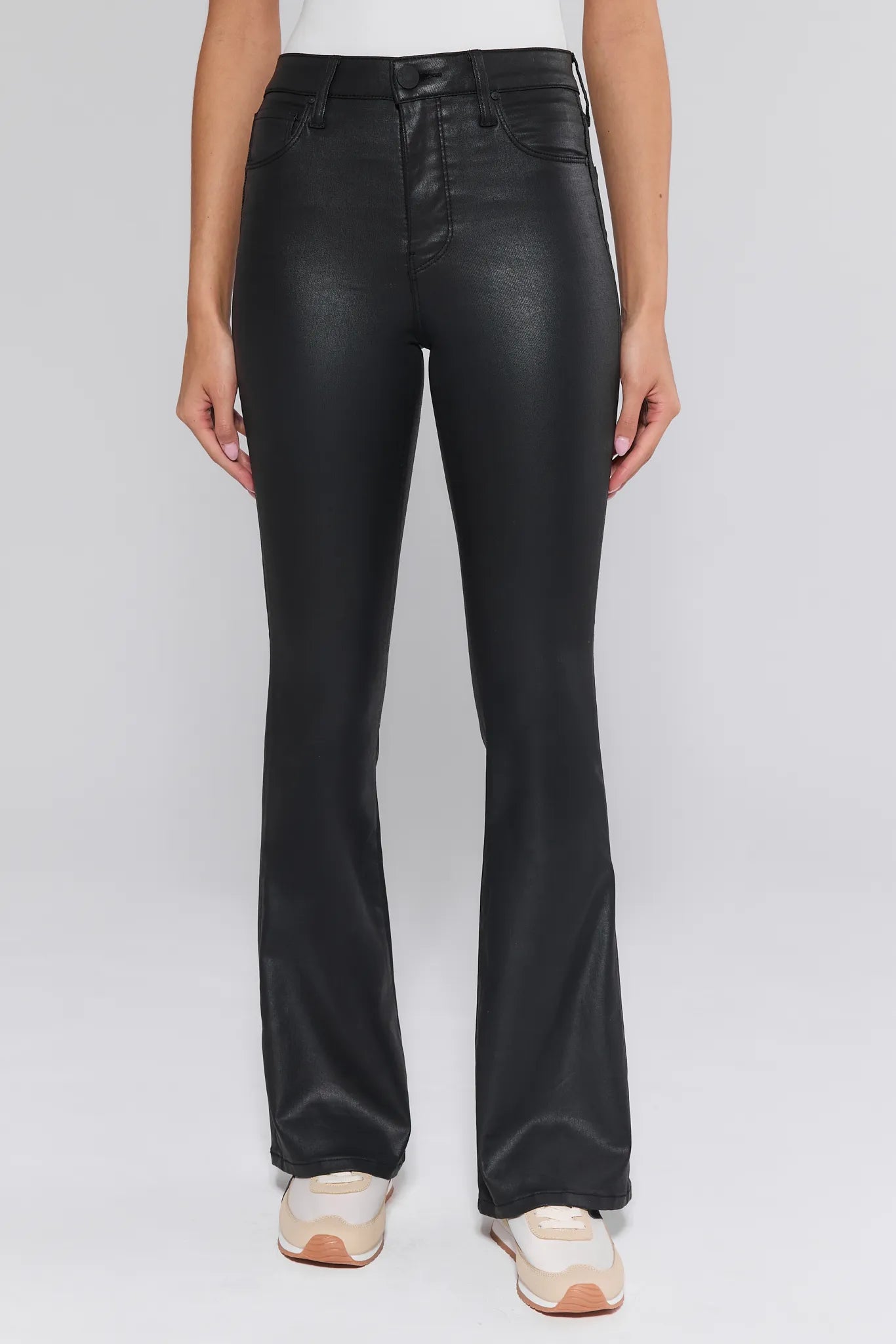 Person wearing black Ana Jeans Wax Coated on a white background