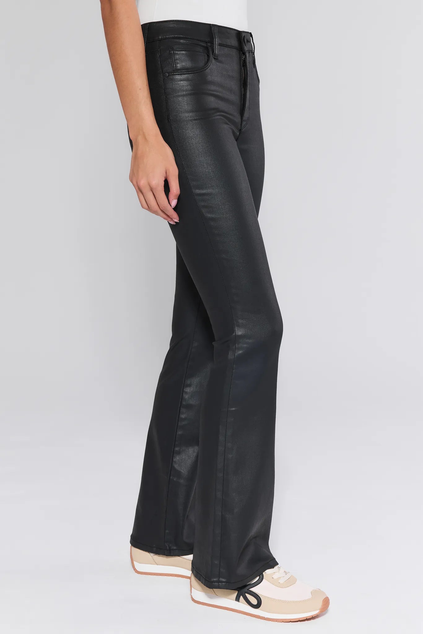 Black Ana Jeans Wax Coated worn by a person on a white background