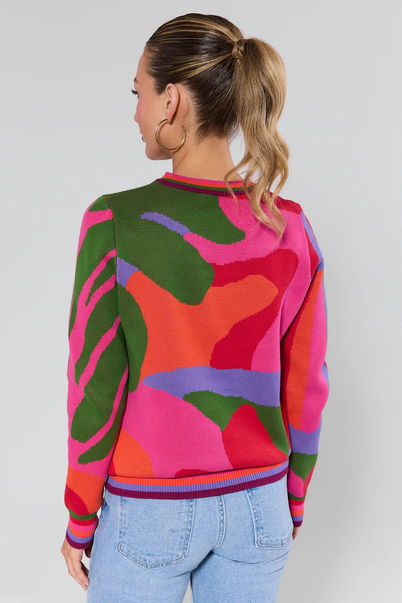 Woman wearing a Marcia Multicolor Knit Sweater against a plain background