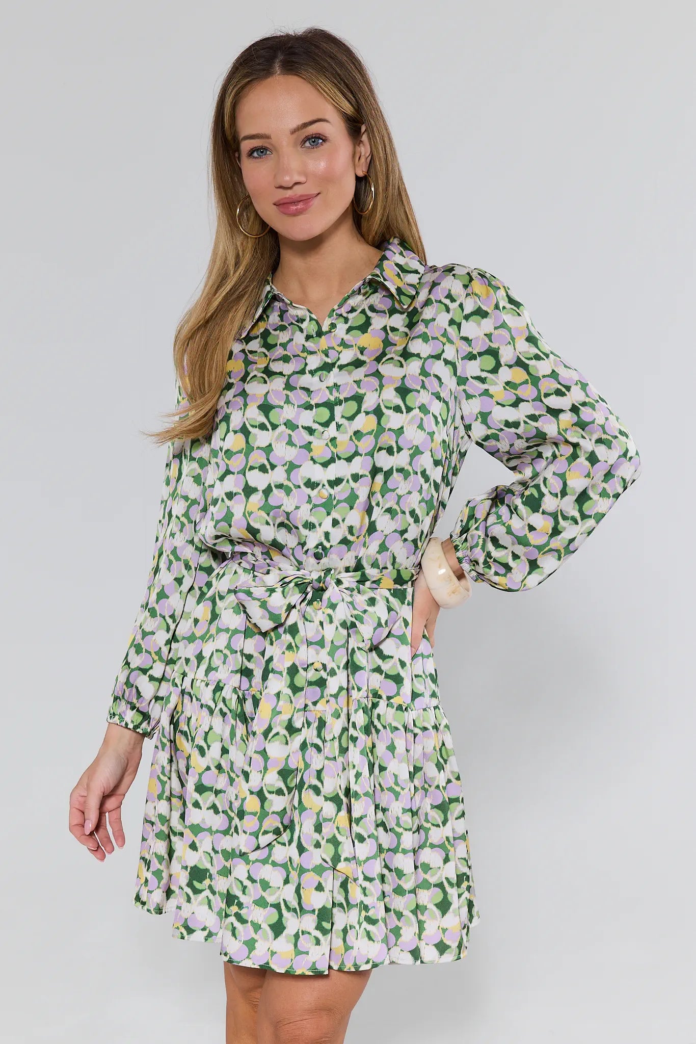 Woman wearing a floral dress with a white background