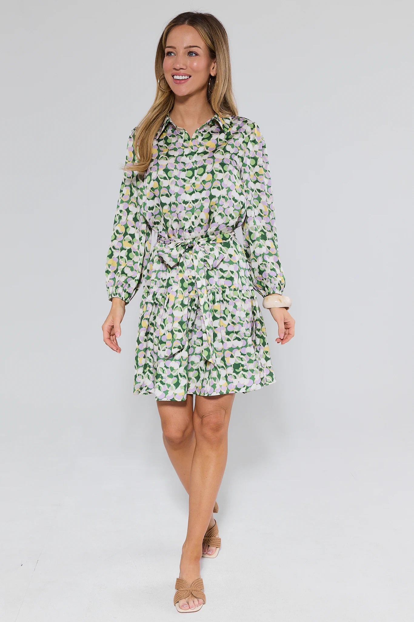 Woman wearing a floral dress on a white background