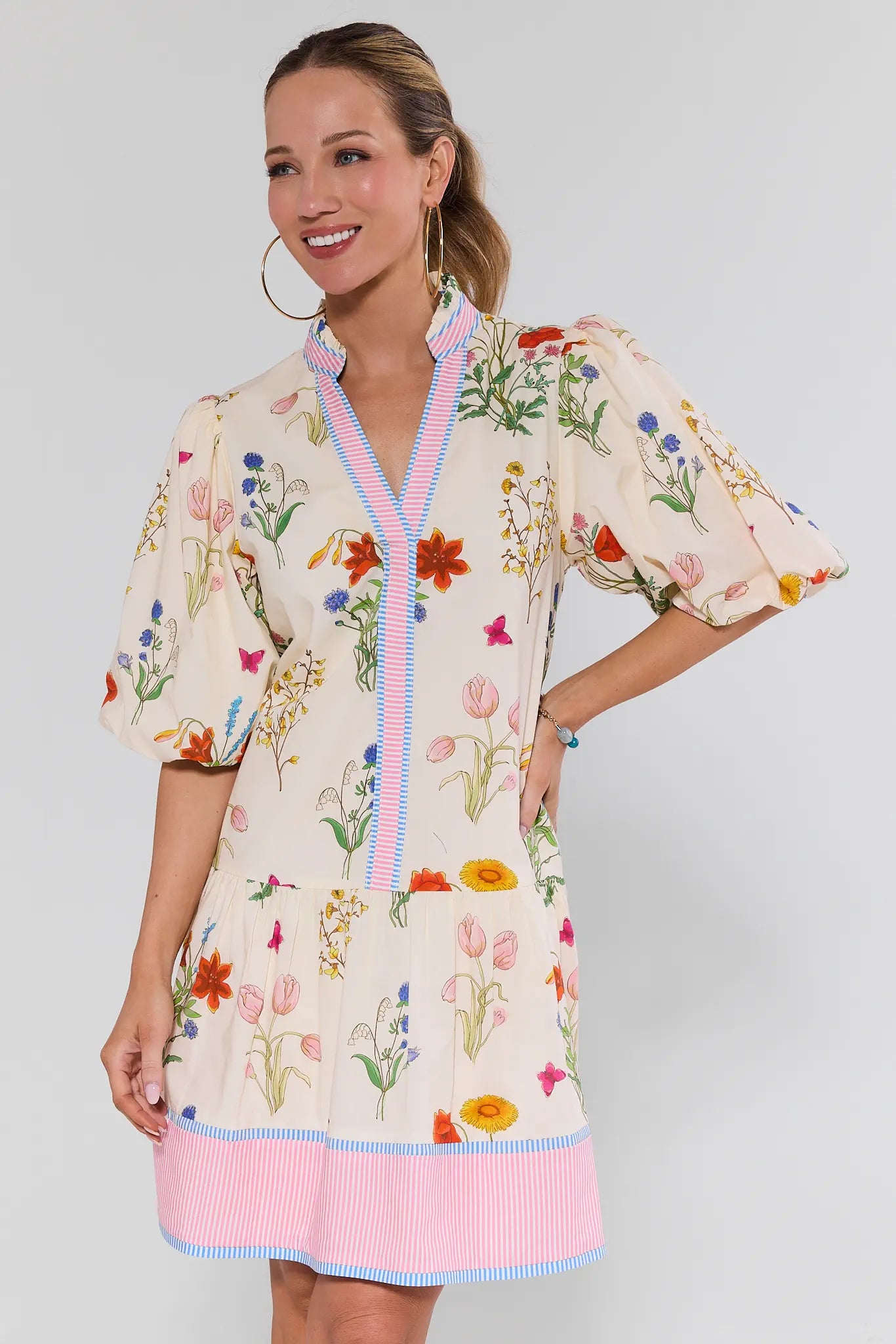 Woman wearing a floral dress with a white background