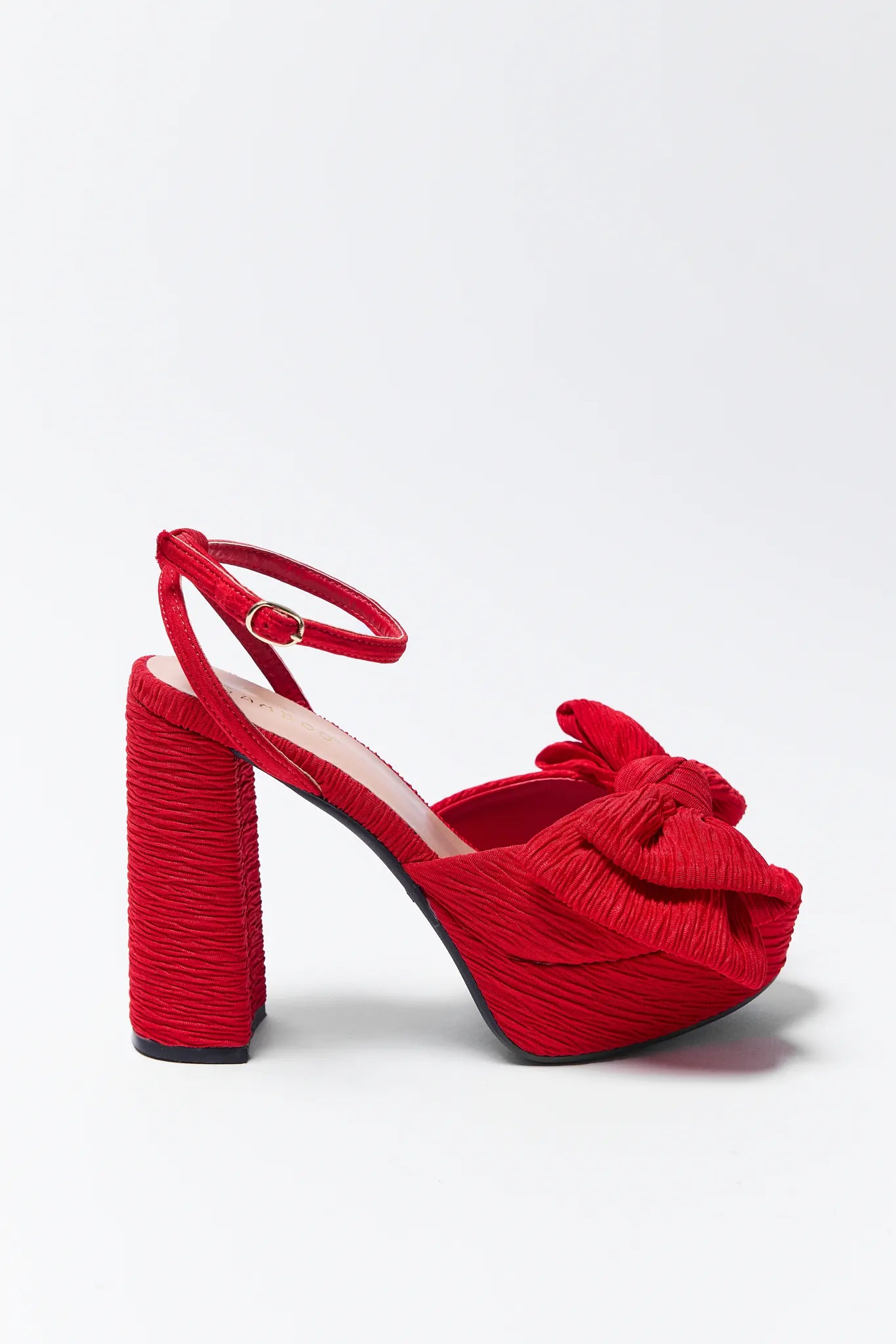 Nicole Red Platform Heels with bow details on a white background
