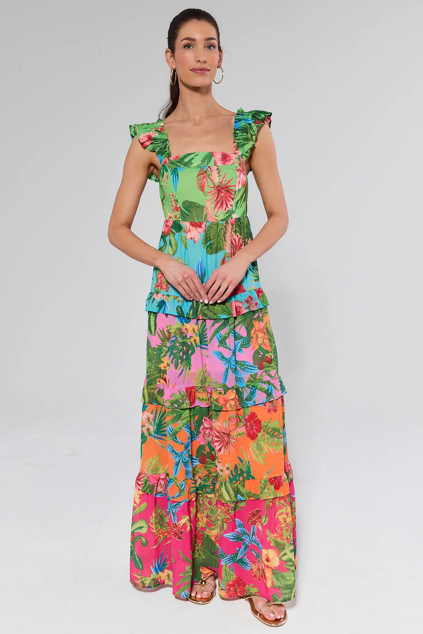 Woman wearing a colorful dress on a white background