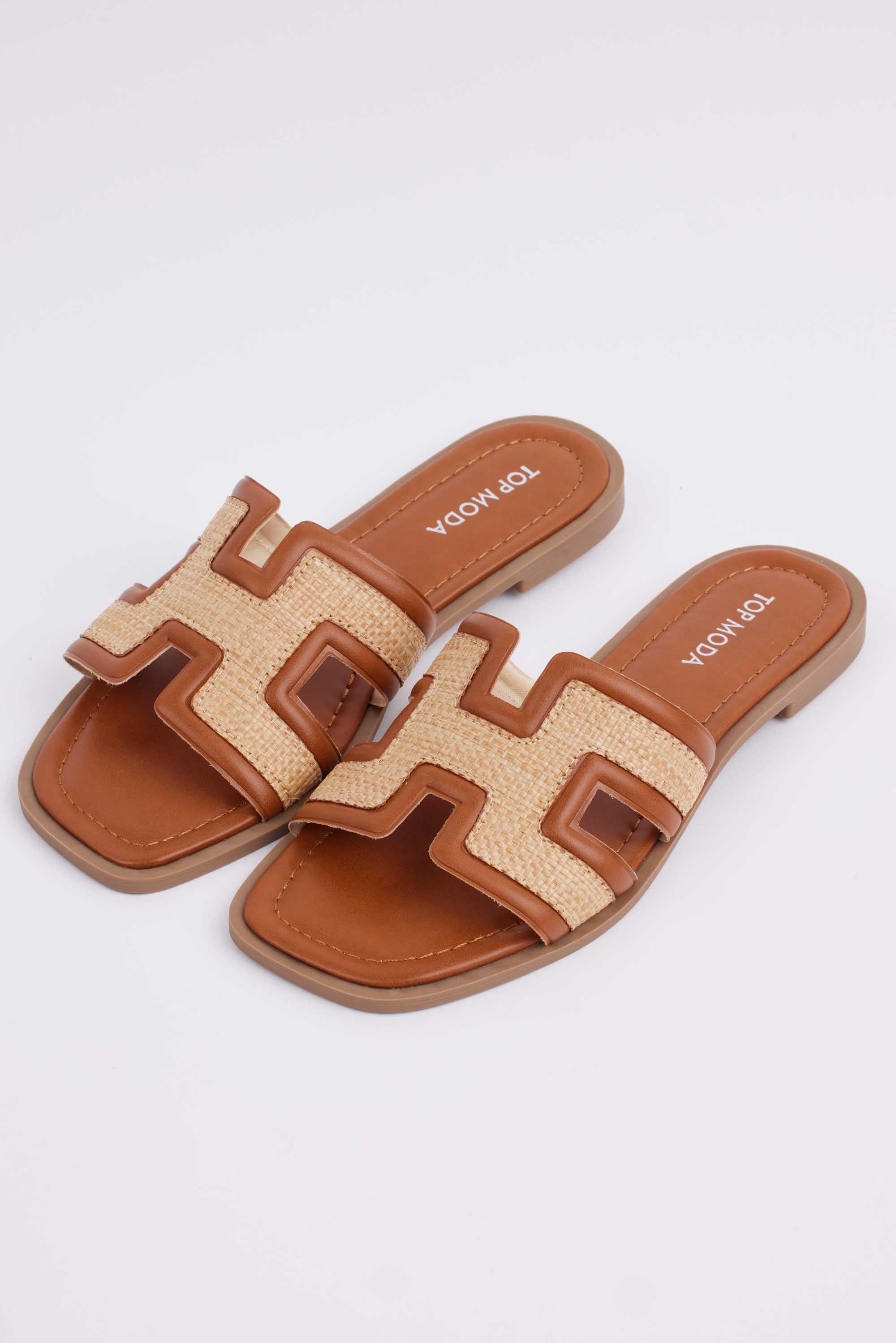 brown Hensley sandals with a raffia and leather upper, featuring a slip-on style and a rubber sole.