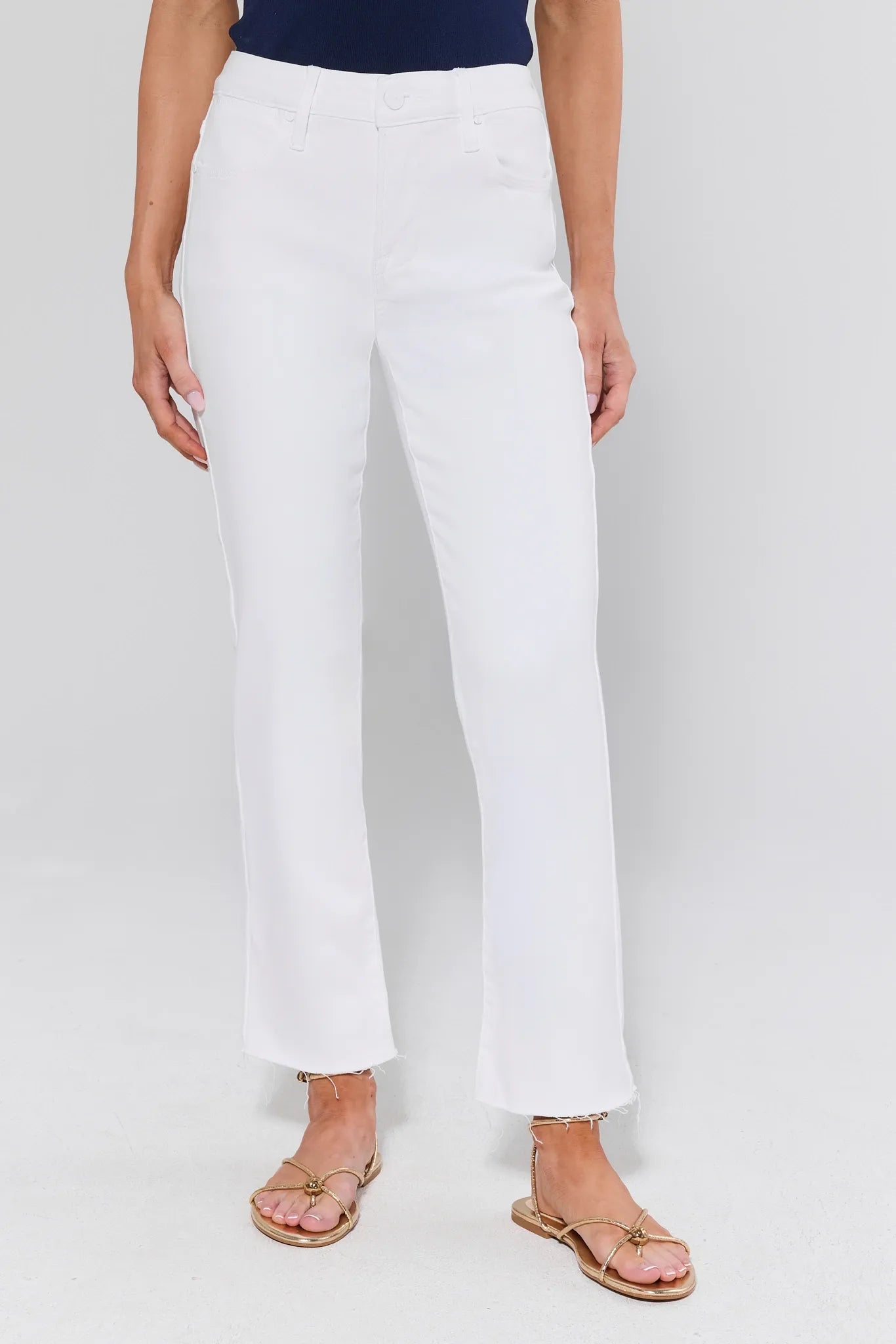 View 1: Person wearing white pants on a plain background